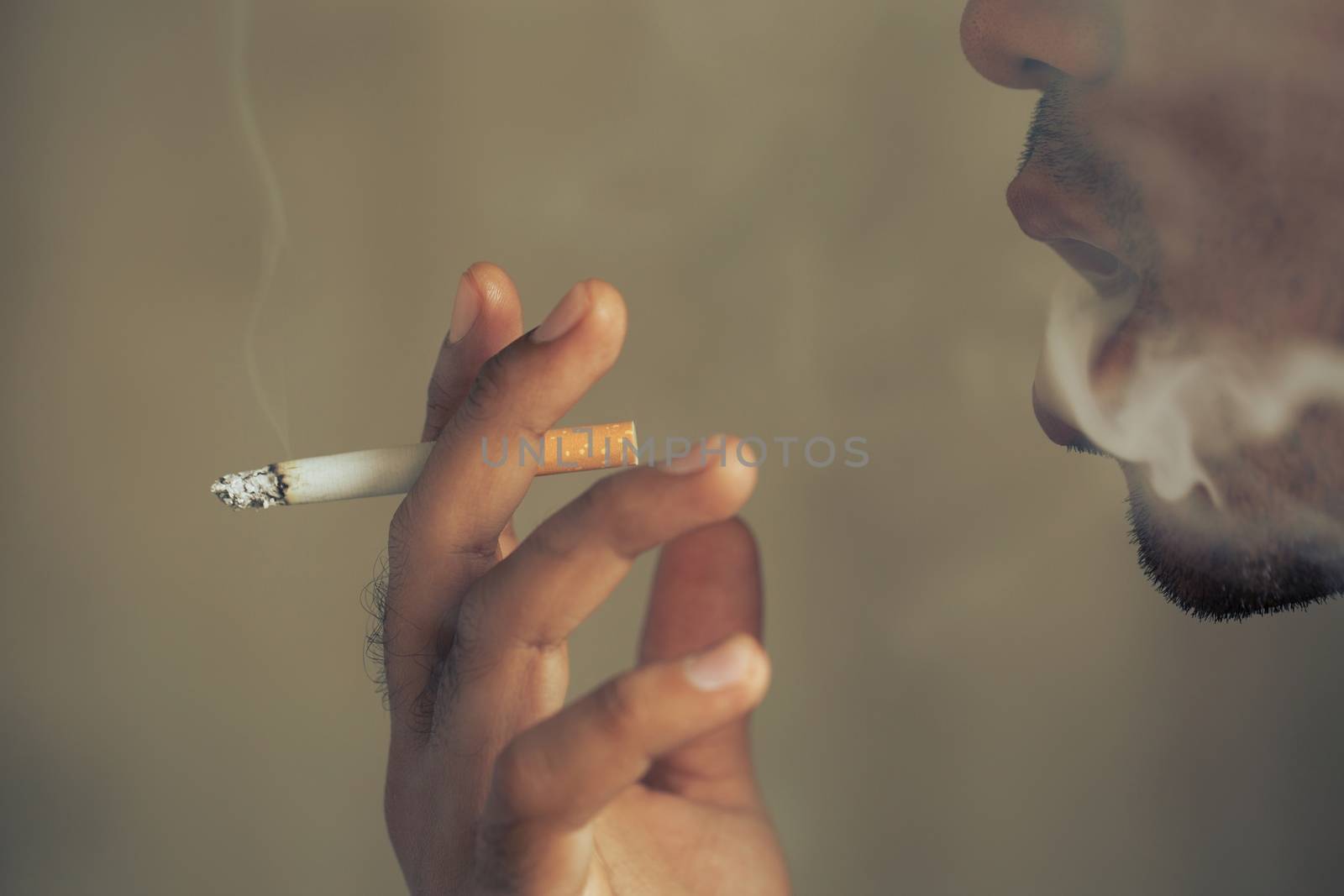 A man is smoking by boytaro1428@gmail.com