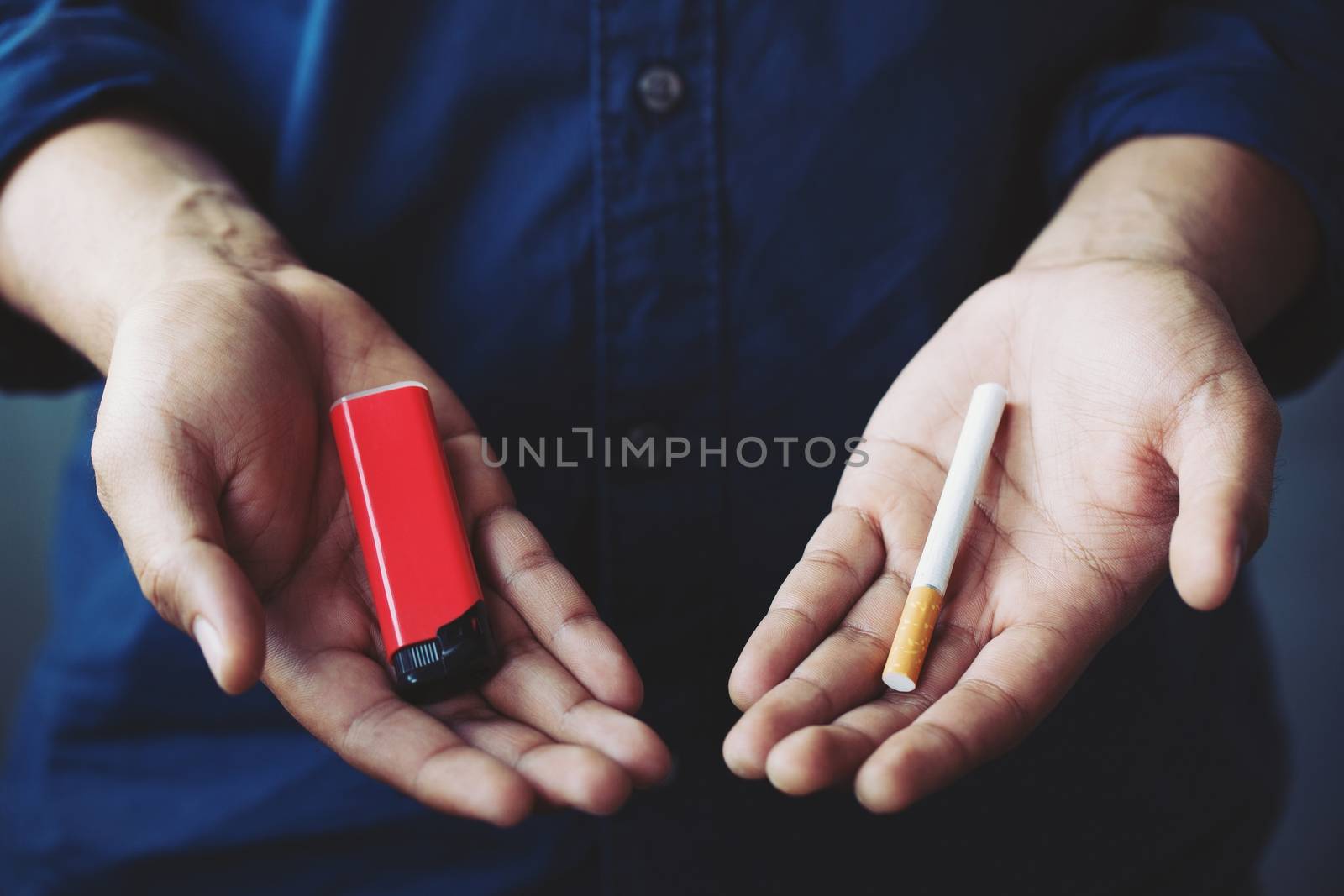 Male handle use lighters going to smoking a cigarette.