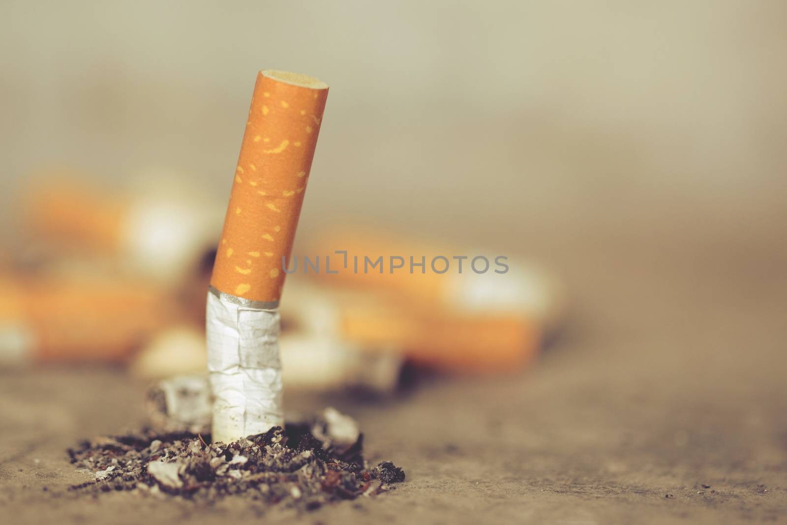 World No Tobacco Day Concept Stop Smoking.tobacco cigarette butt on the floor by boytaro1428@gmail.com