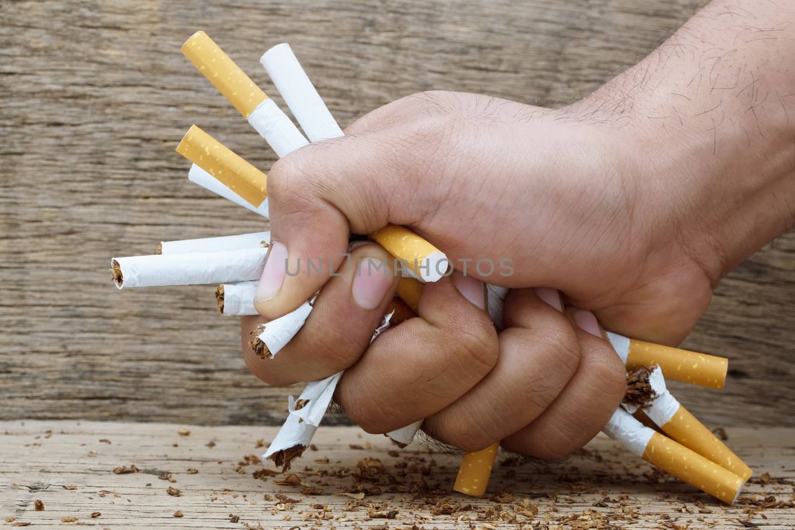 Man trying to give up smoking cigarette . Concept world no tobacco day campaign.