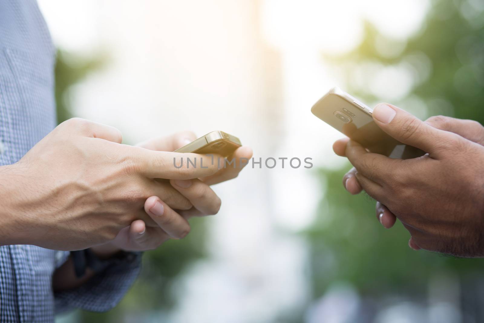 Businessman use smartphones to contact customers