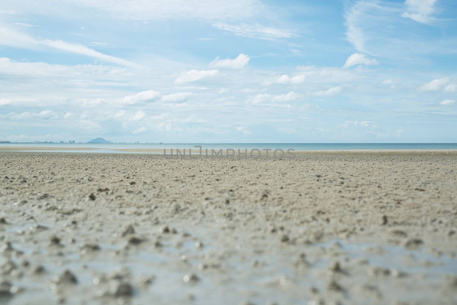 Hot weather Dry sea water see the sandy shelf seaside.