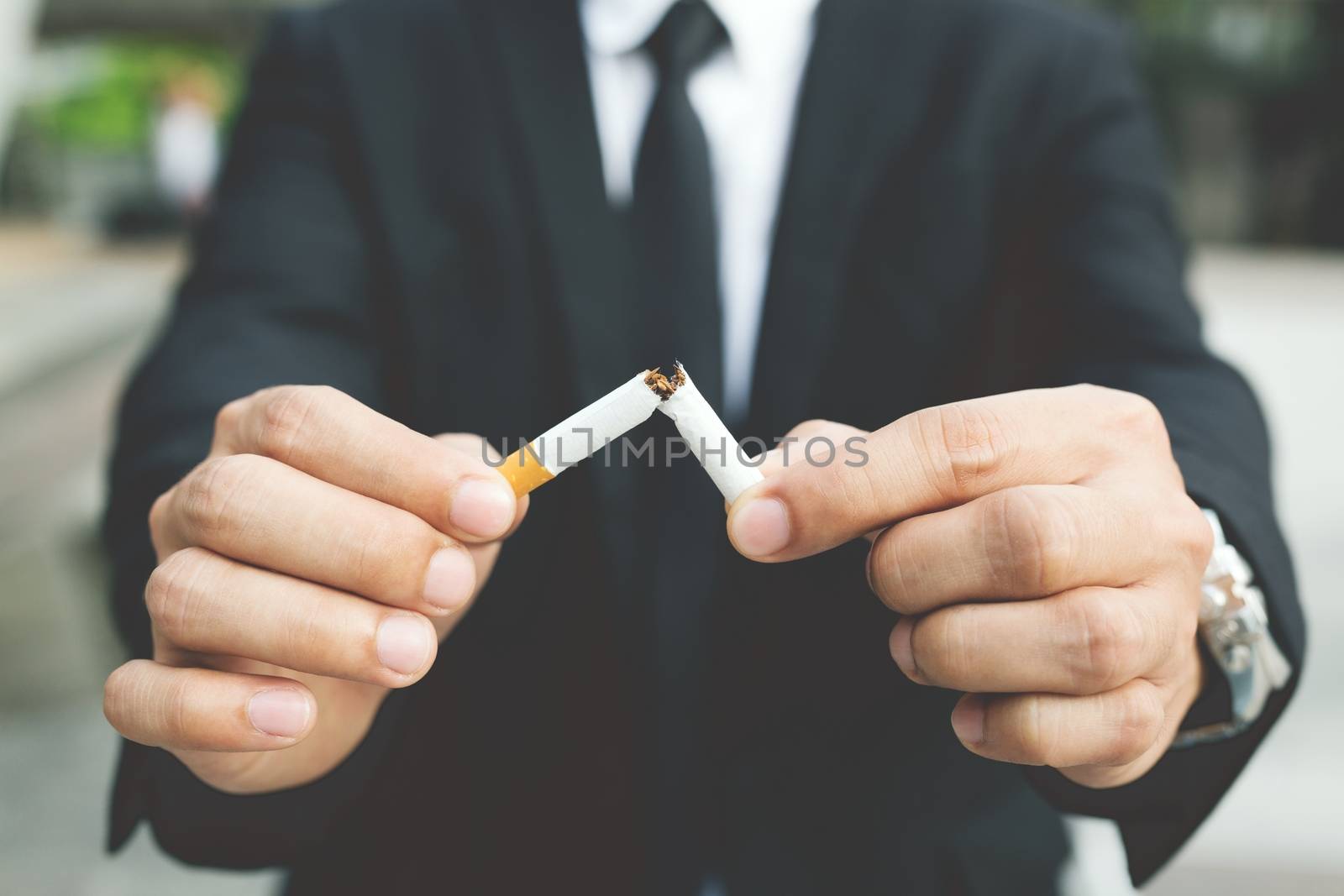 A new generation of businessman refusing cigarettes concept for quitting smoking and healthy lifestyle.or No smoking campaign Concept. by boytaro1428@gmail.com