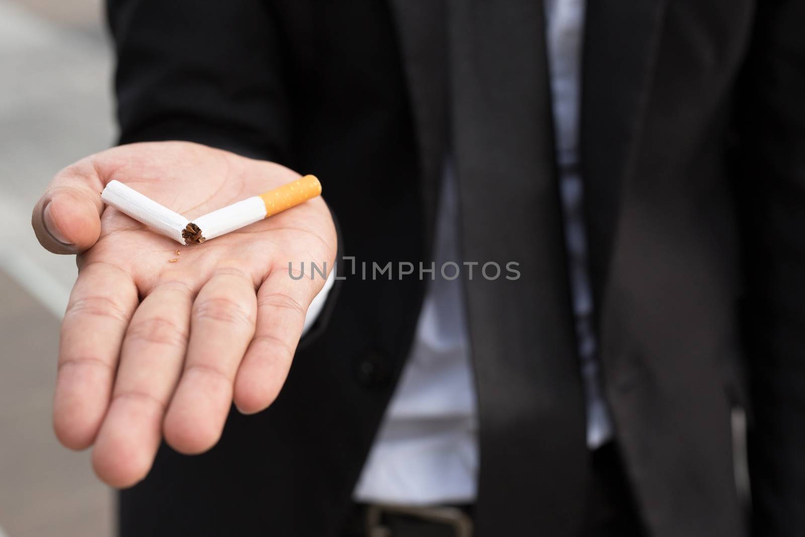 A new generation of businessman refusing cigarettes concept for quitting smoking and healthy lifestyle.or No smoking campaign Concept. by boytaro1428@gmail.com