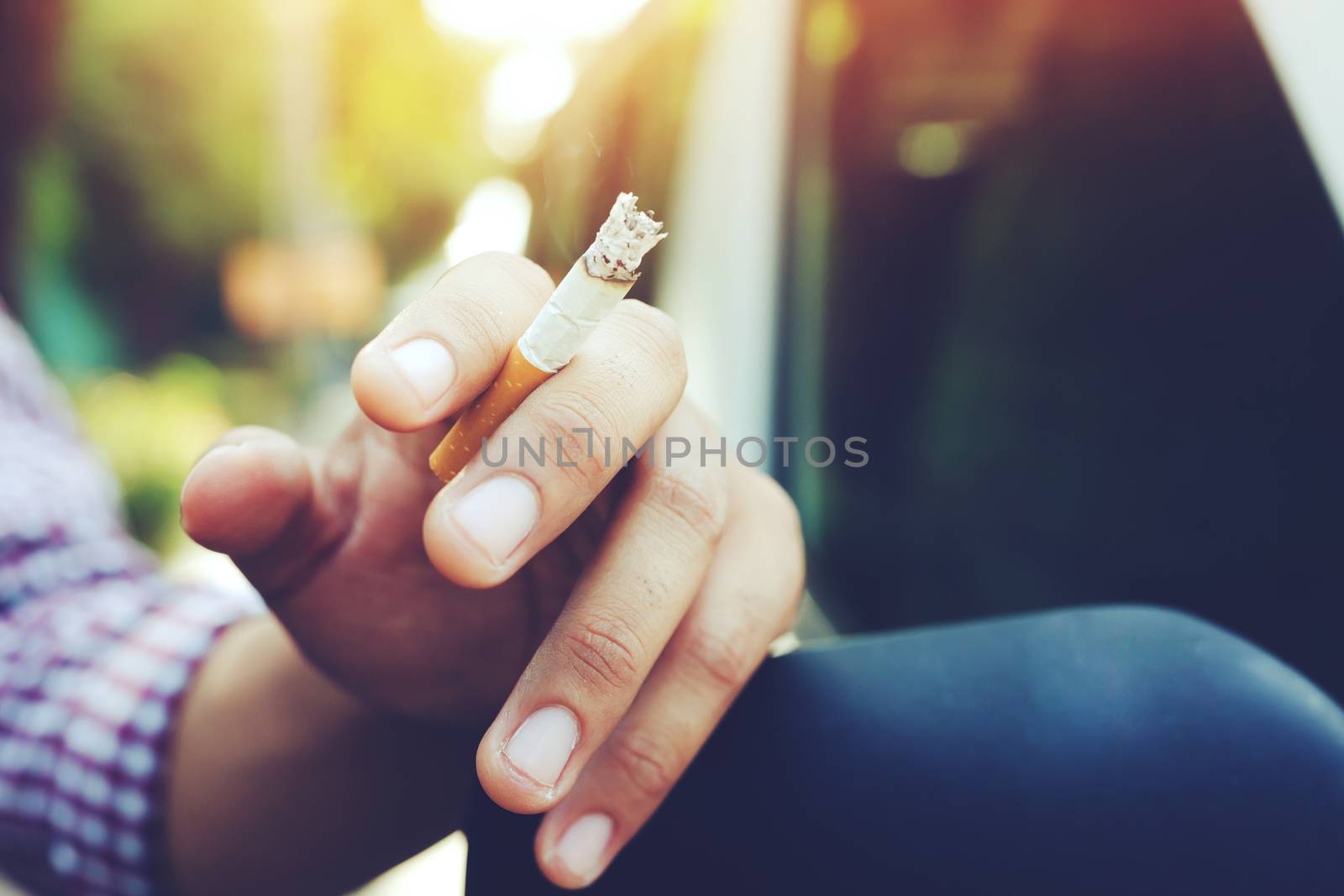 A man is smoking by boytaro1428@gmail.com