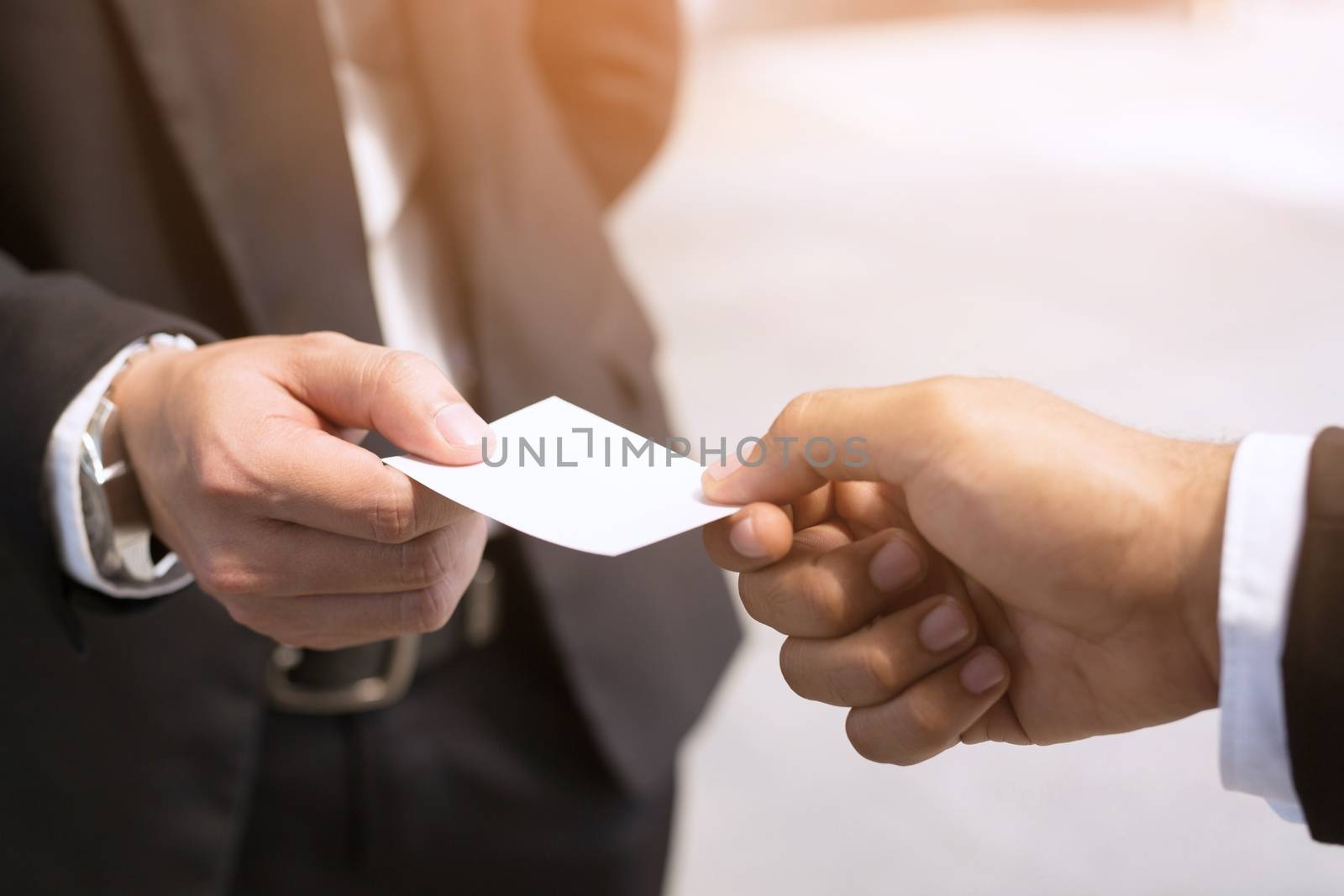 business man in hand hold show business cards blank white card mock up filing give to connect business contacts. Business branding concept.