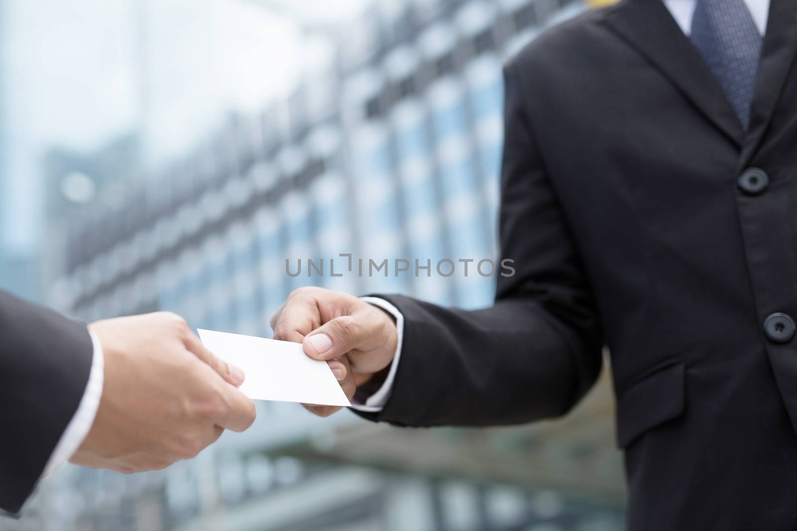 business man in hand hold show business cards blank white card mock up filing give to connect business contacts. Business branding concept.