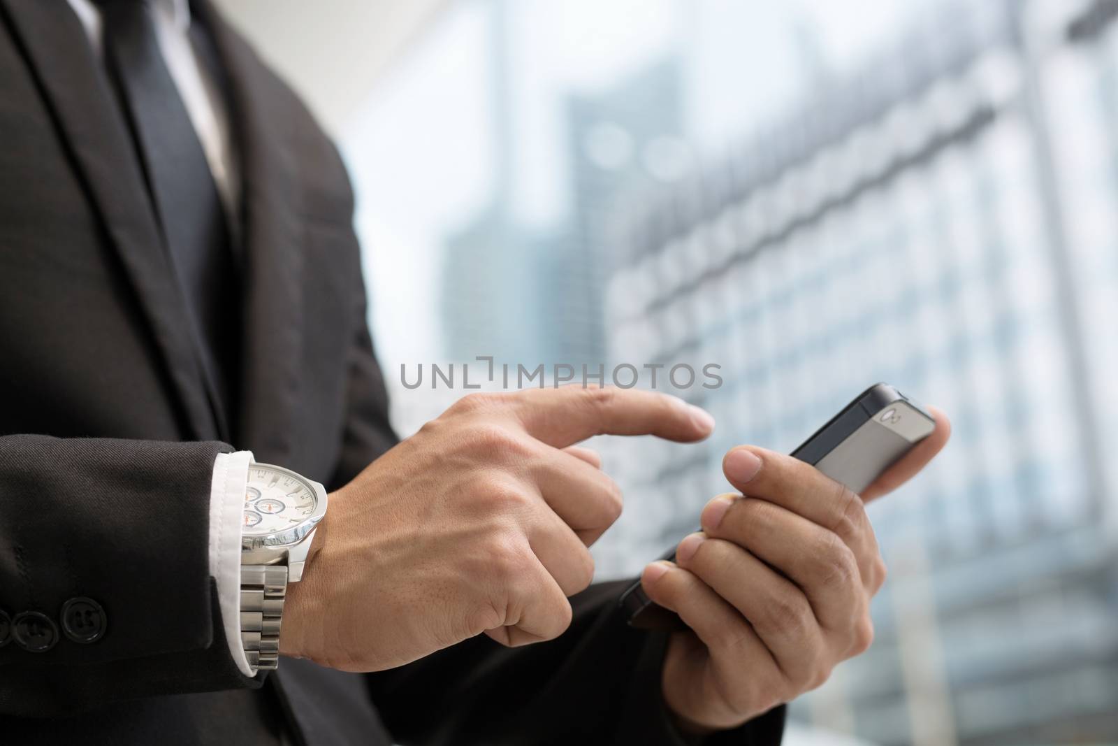 Businessman use smartphones to contact customers by boytaro1428@gmail.com