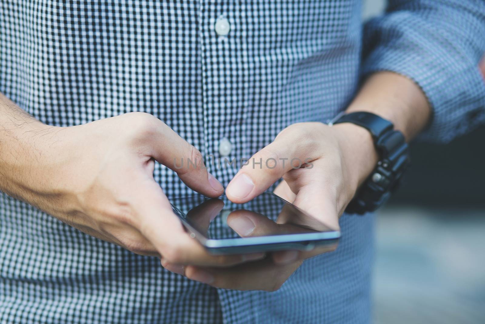 Businessman use smartphones to contact customers