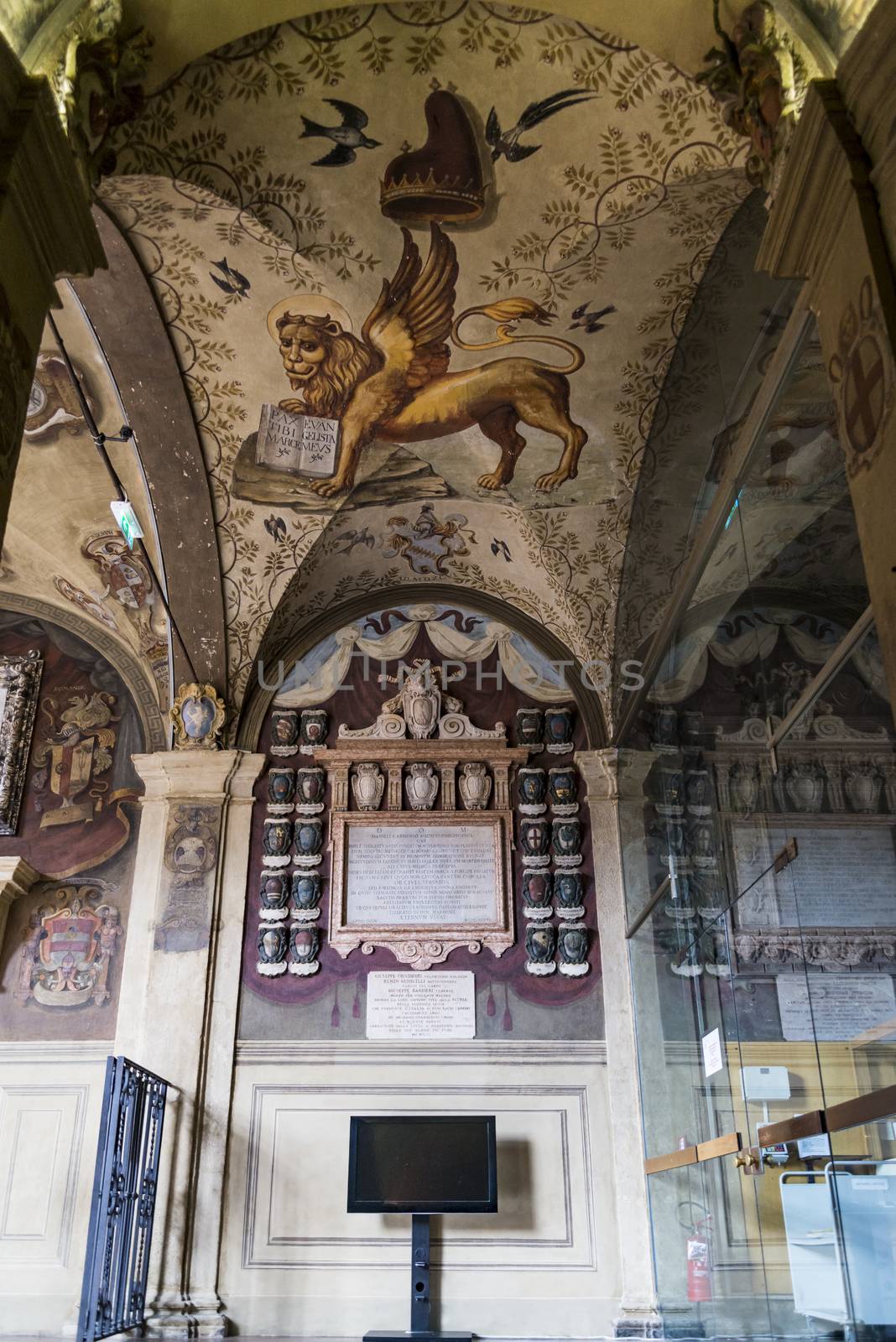 Decorations on the wall and the portico in Archiginnasio library of Bologna. It is one of the most important building on June 25, 2017 in Bologna, Italy.
