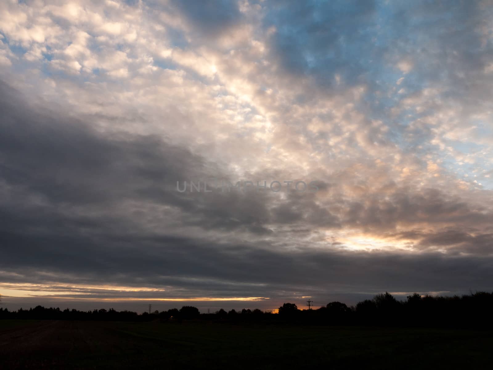 glowing stunning dramatic morning cloudy blue sky overhead space; essex; england; uk