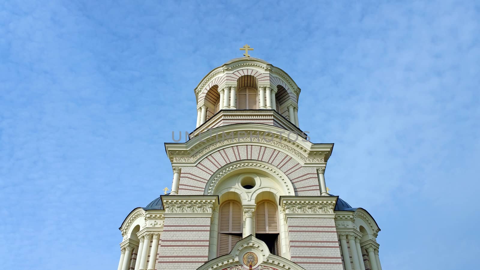 Church tower against on the blue sky