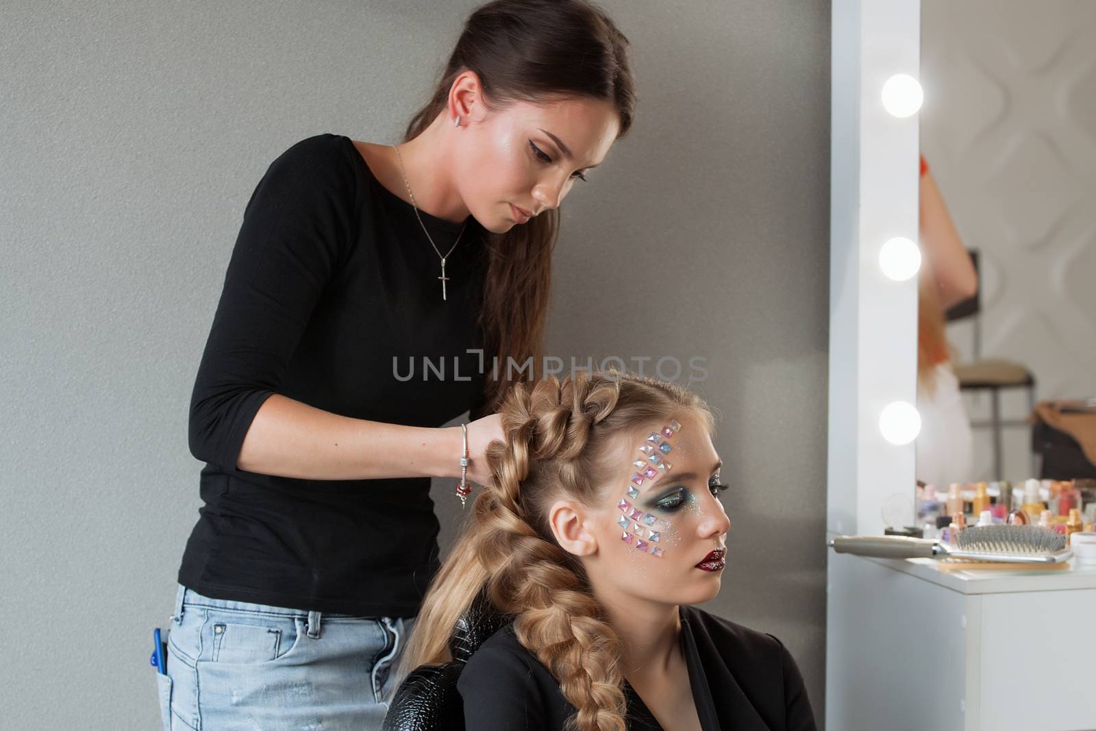 Weave braid girl in a hair salon.