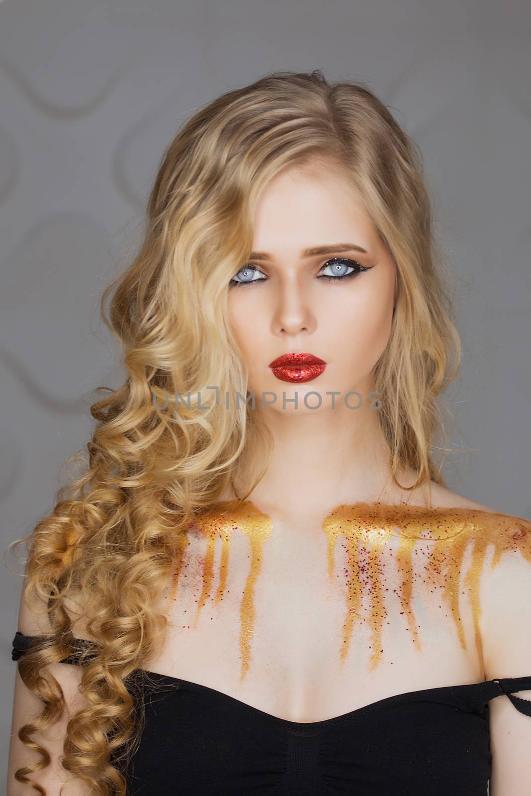 Fashion makeup. Woman with colorful makeup and body art.