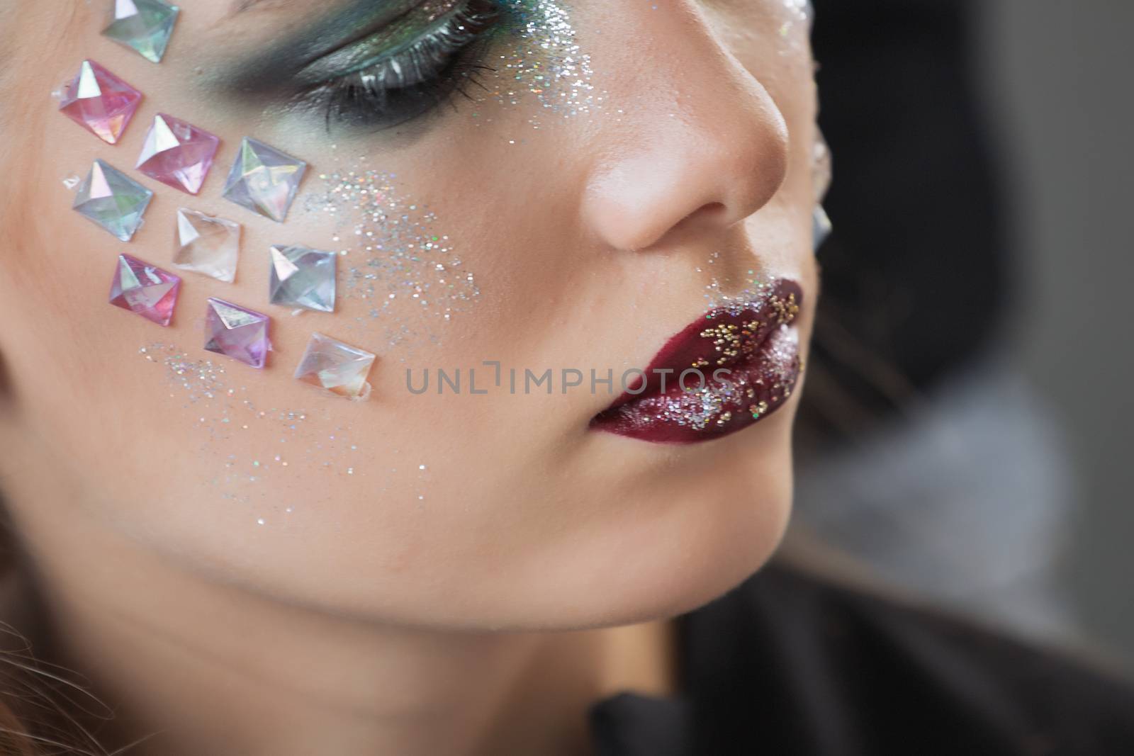 Fashion makeup. Woman with colorful makeup and body art by 3KStudio