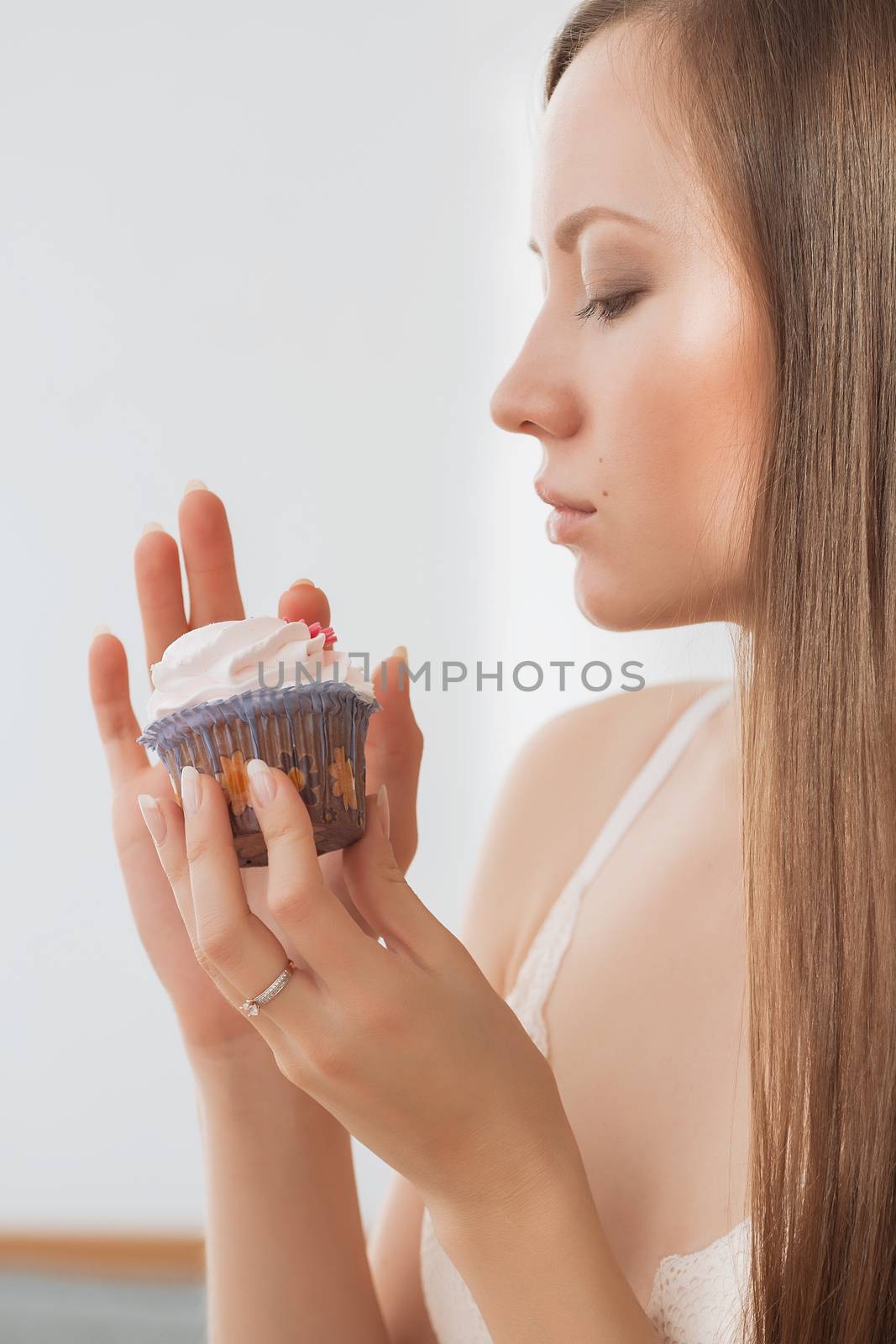 Woman wants to eat a cupcake.