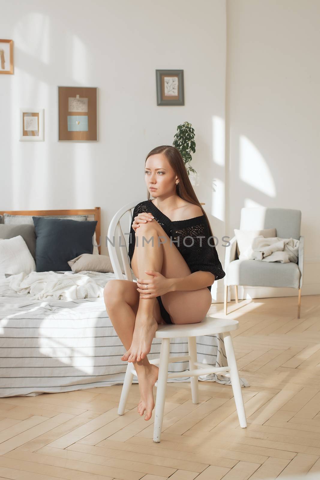 Beautiful young woman in a sexy black underwear.