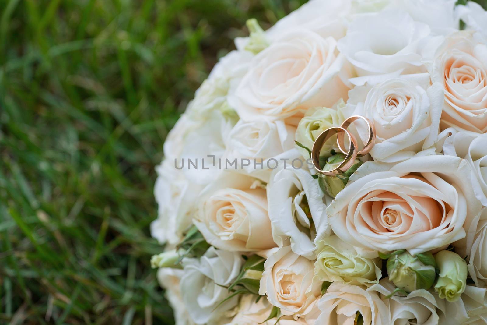 Beautiful wedding bouquet and rings.