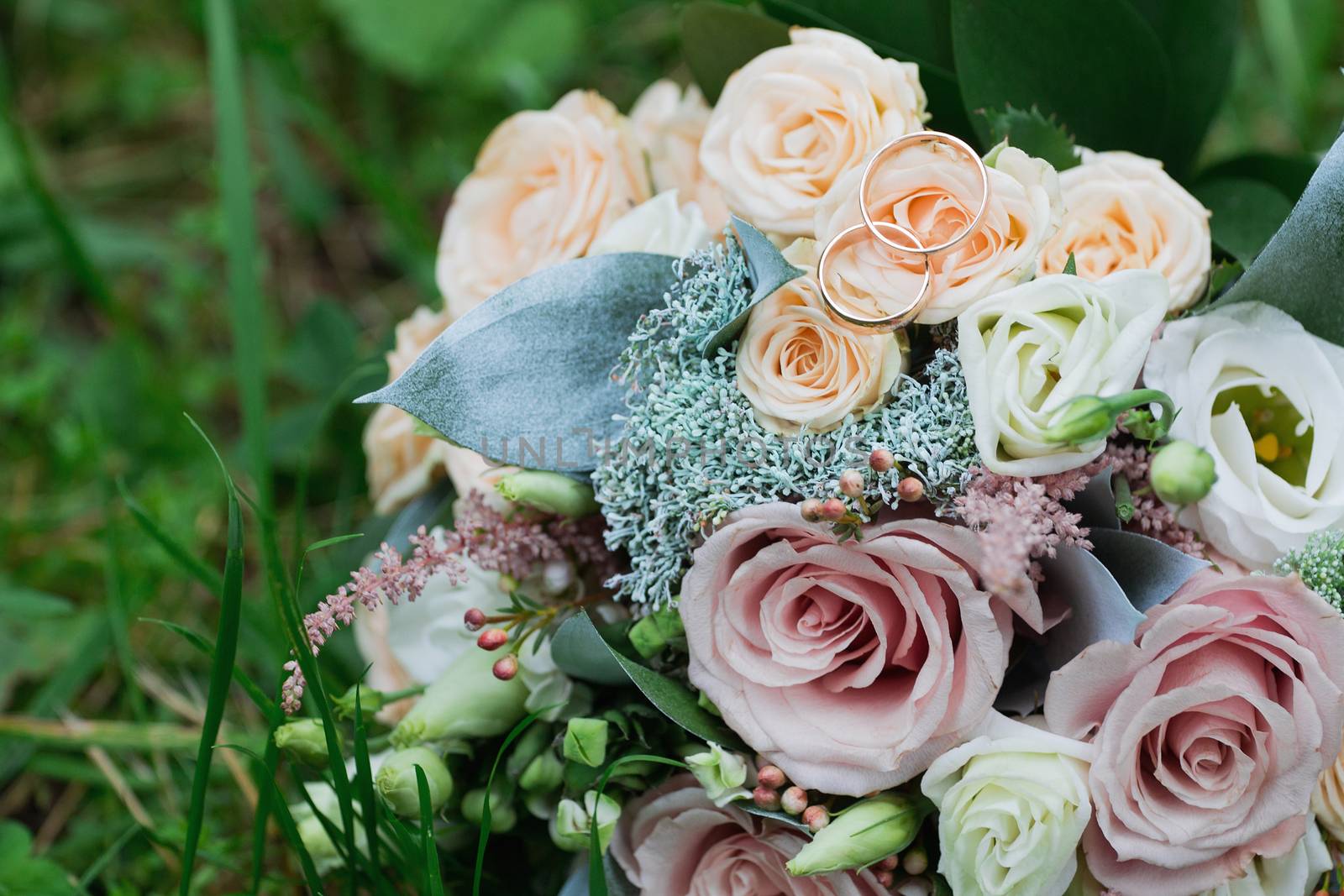 Beautiful wedding bouquet and rings.