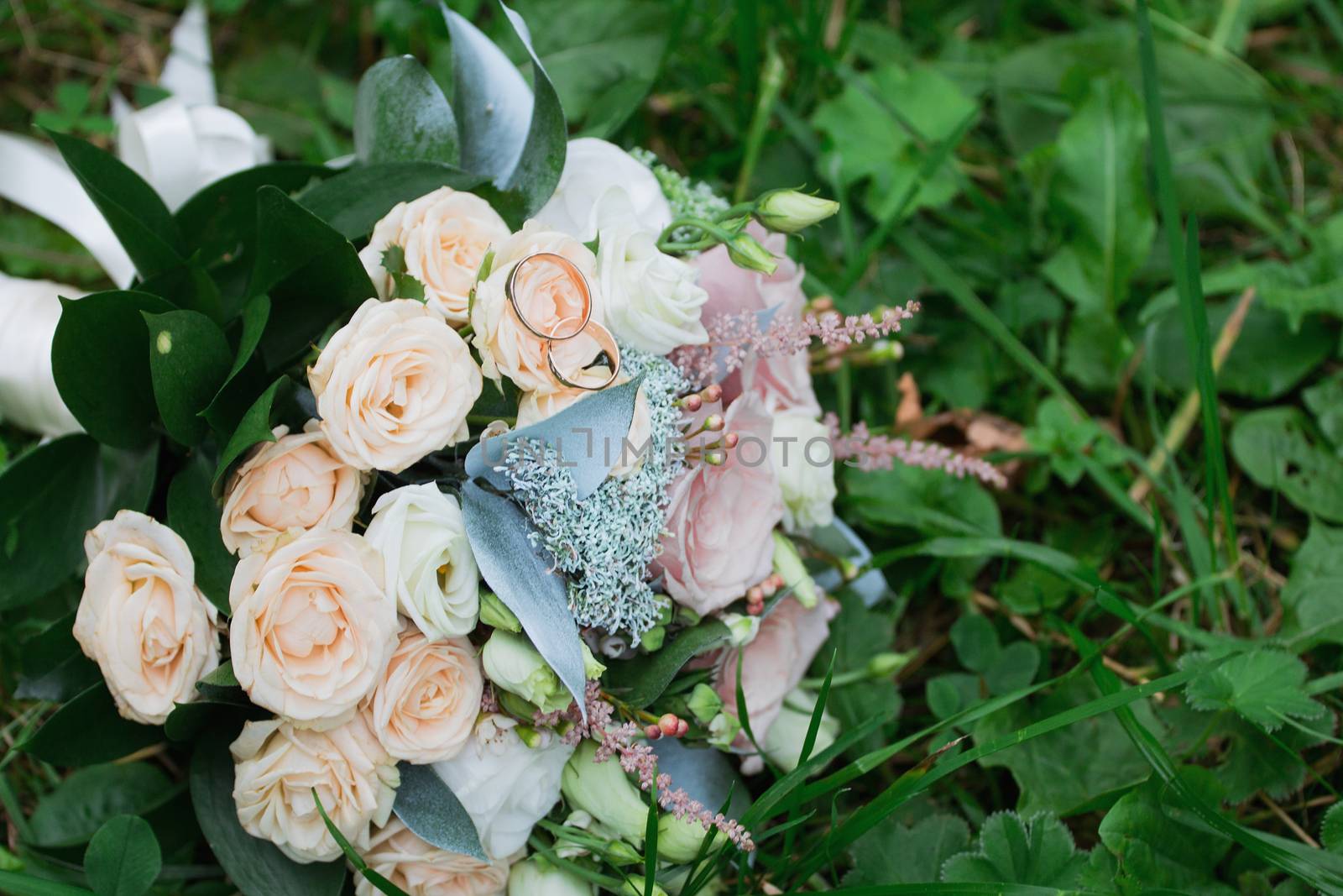 Beautiful wedding bouquet and rings.