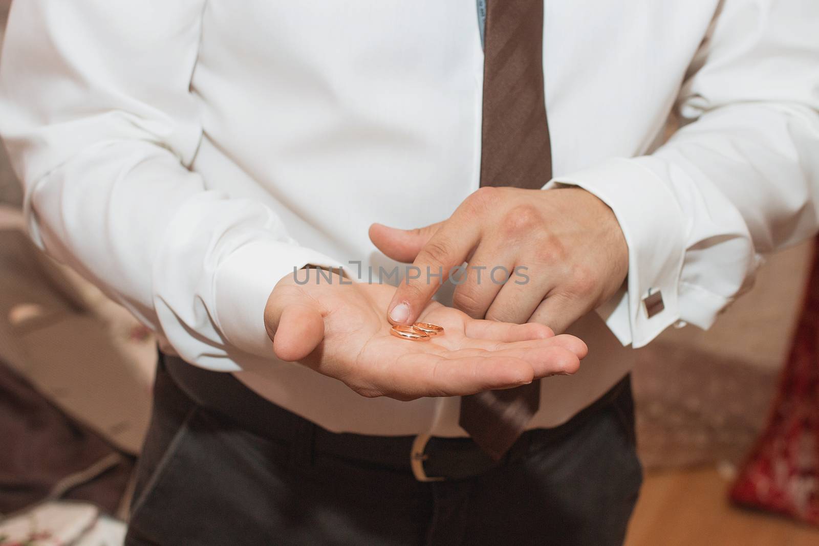 Man is taking off the wedding ring.