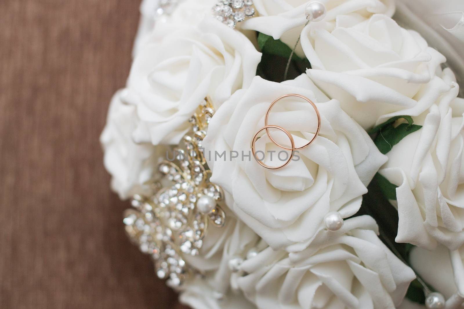 Beautiful wedding bouquet and rings.