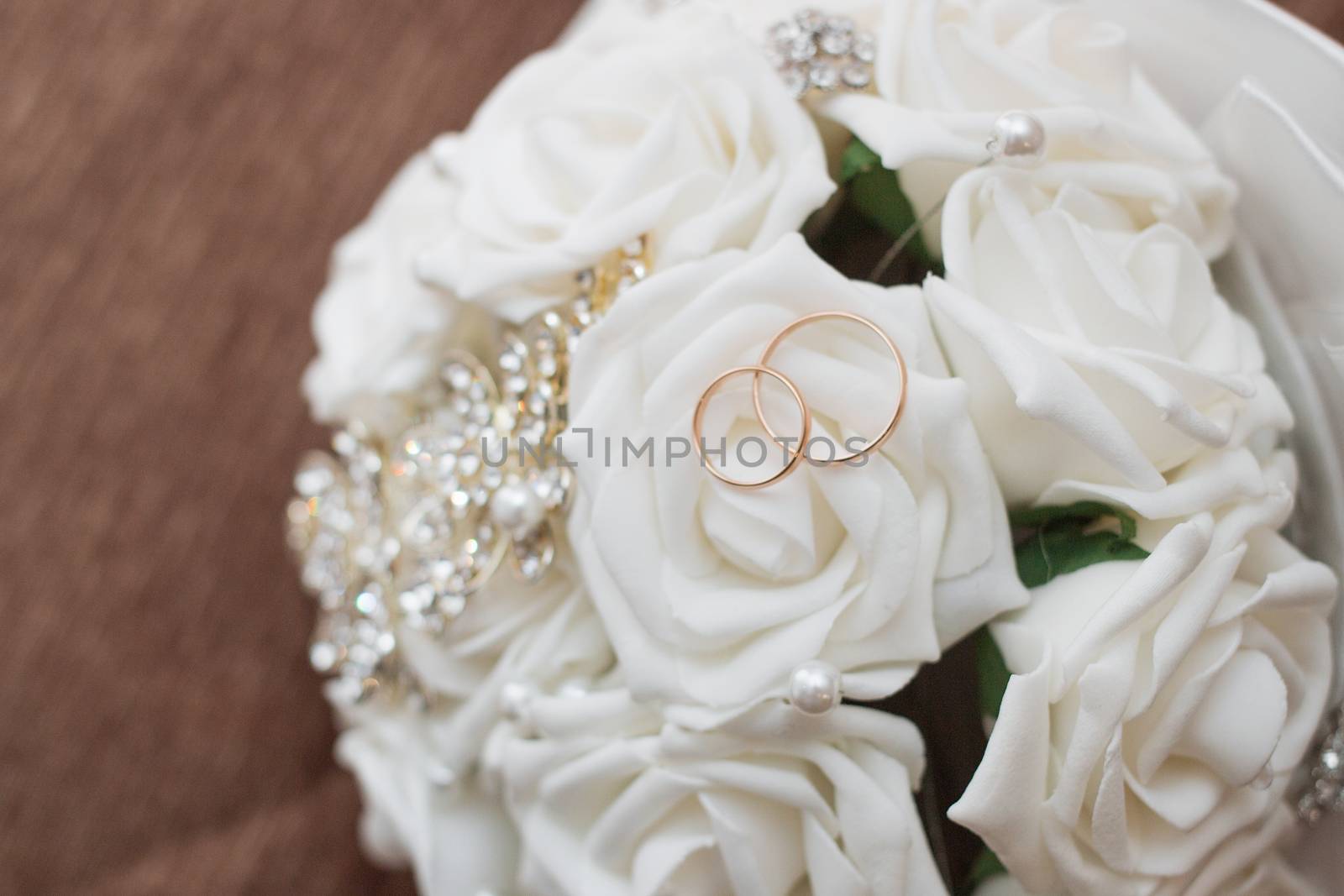 Beautiful wedding bouquet and rings.