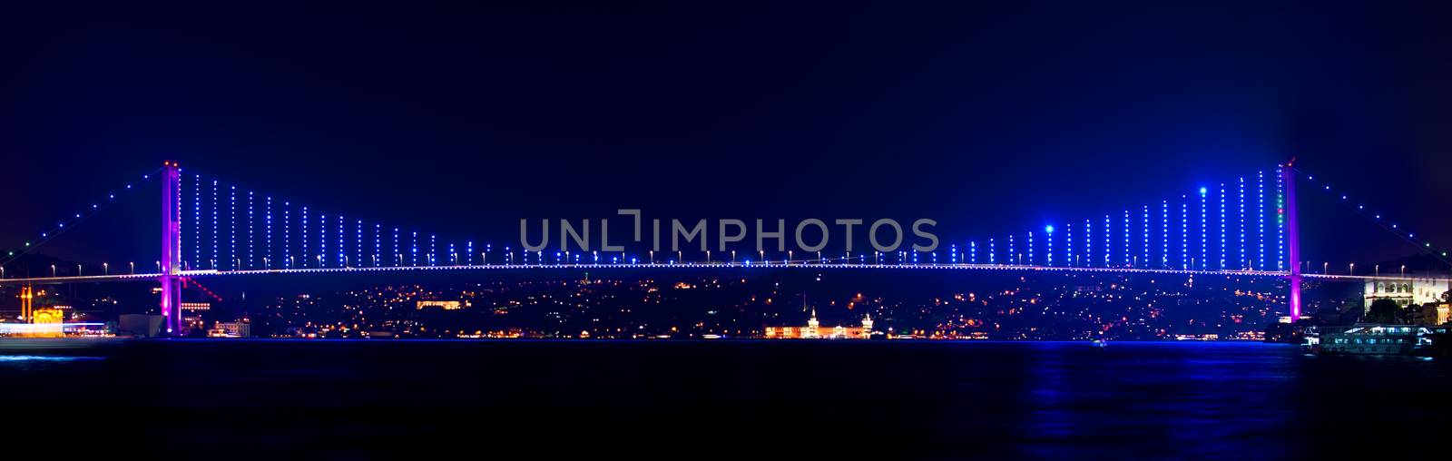 Illuminated Bosphorus bridge in Istanbul at night, Turkey