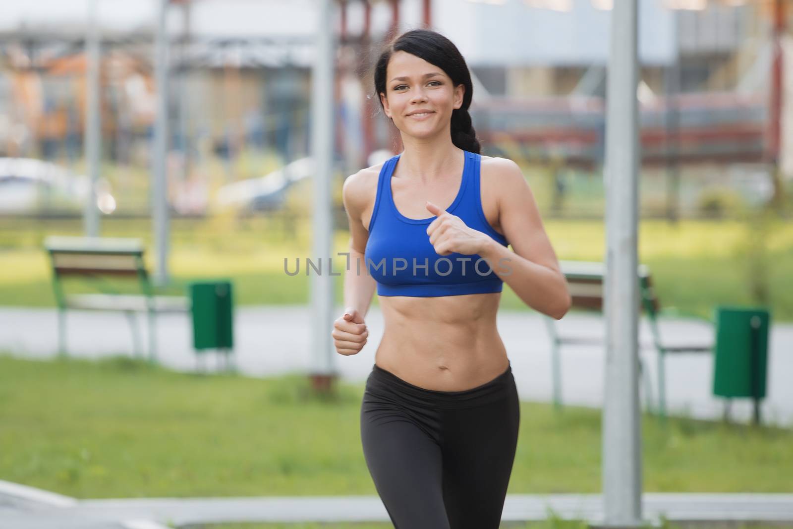 Young fitness woman running at seaside.Girl on the run