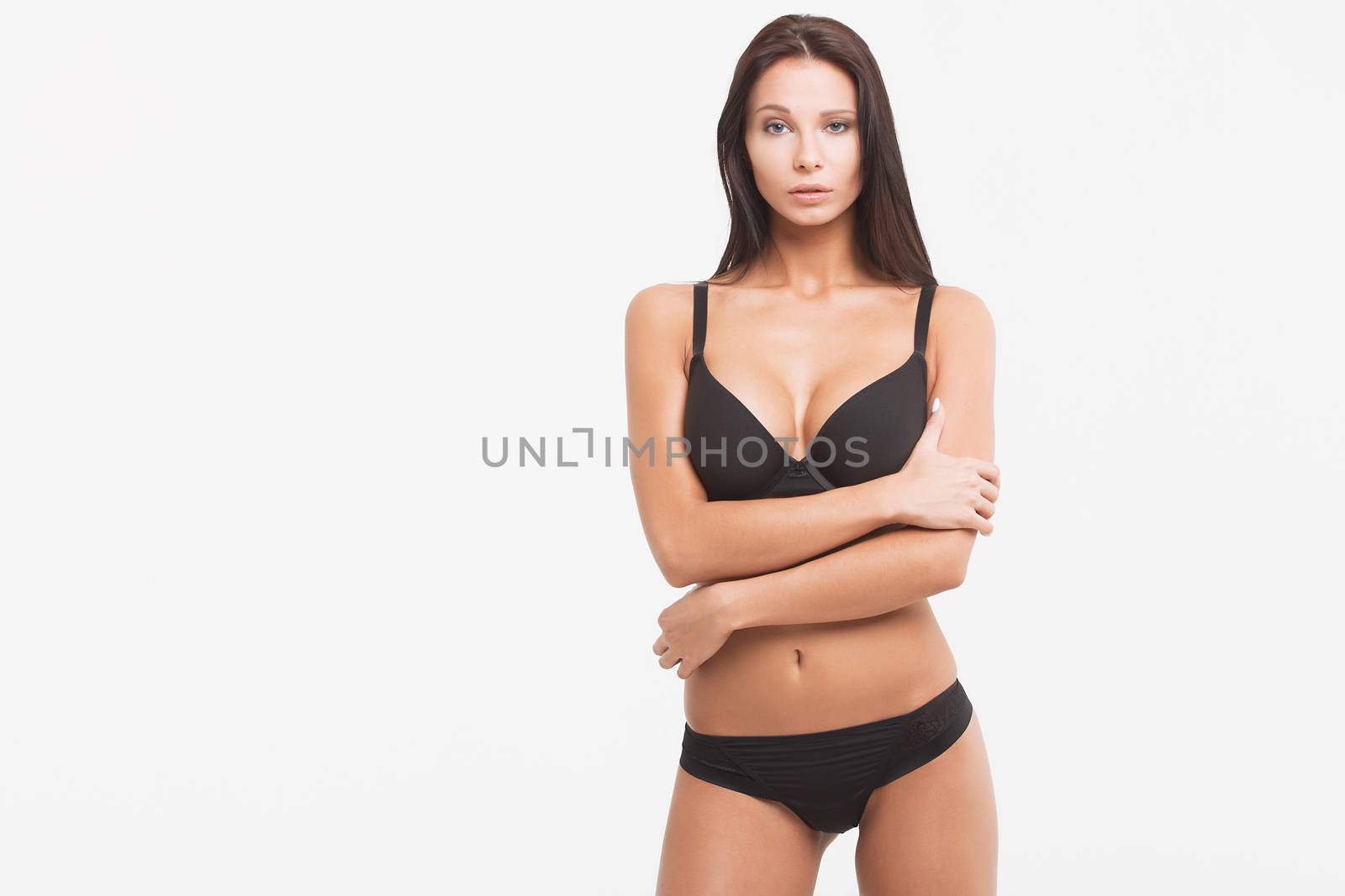 Perfect body young woman on a white background in sexy lingerie by 3KStudio