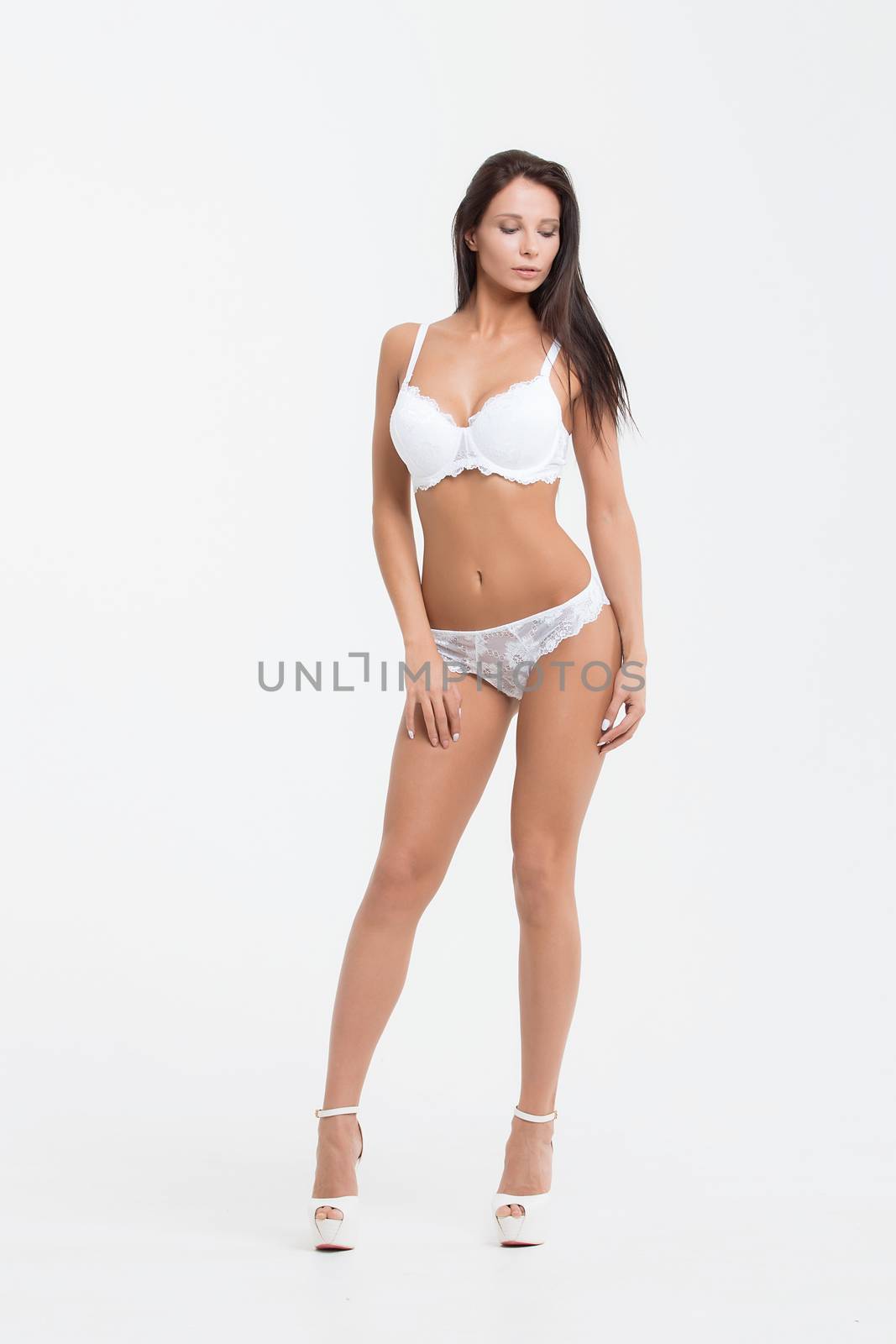 Sexy woman on white background. Perfect womans body.