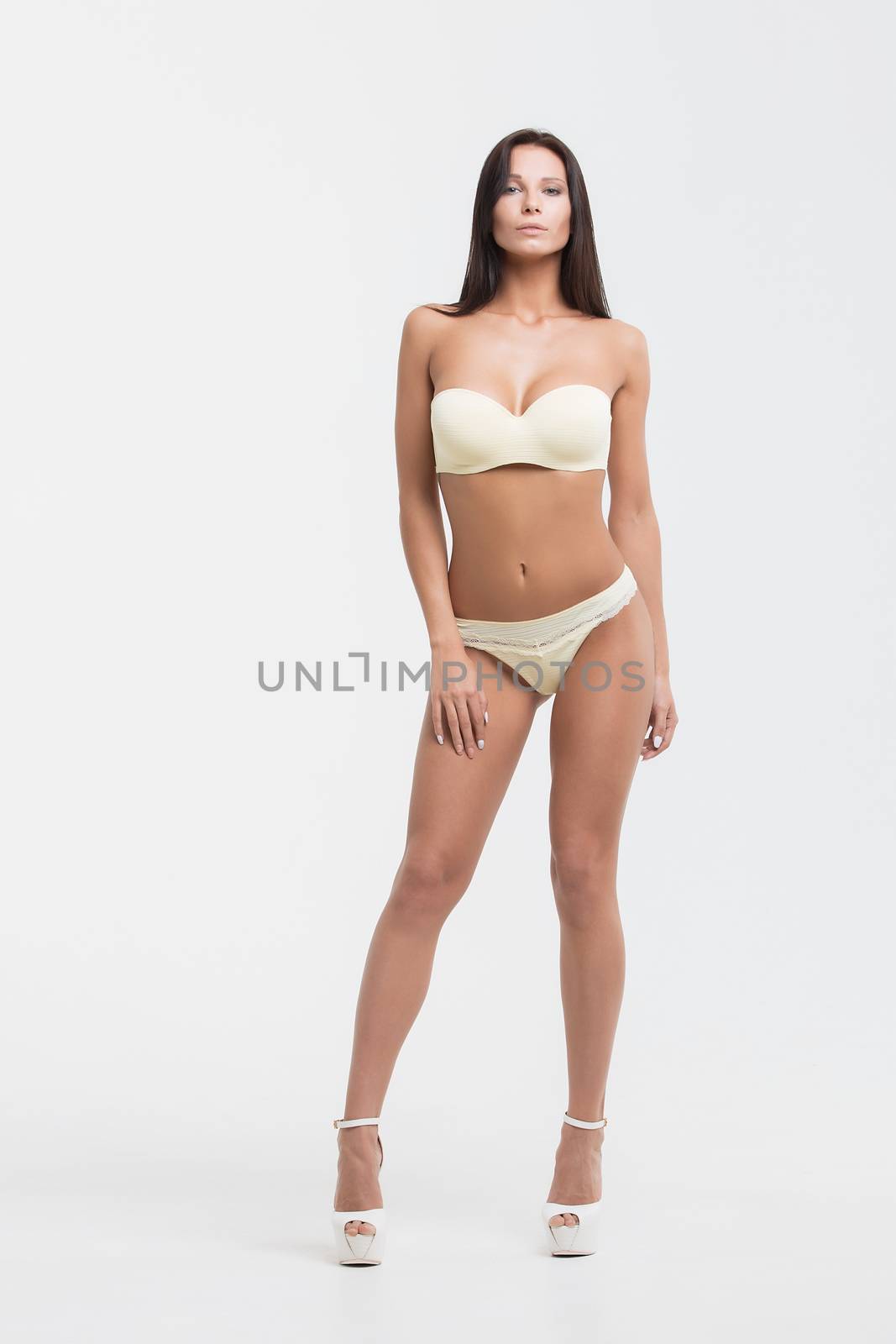 Girl in lingerie on white background by 3KStudio