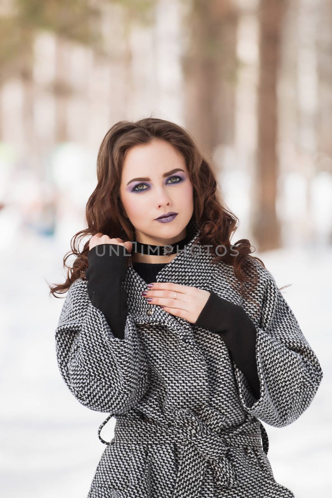 portrait of beautiful young woman smiling in winter time