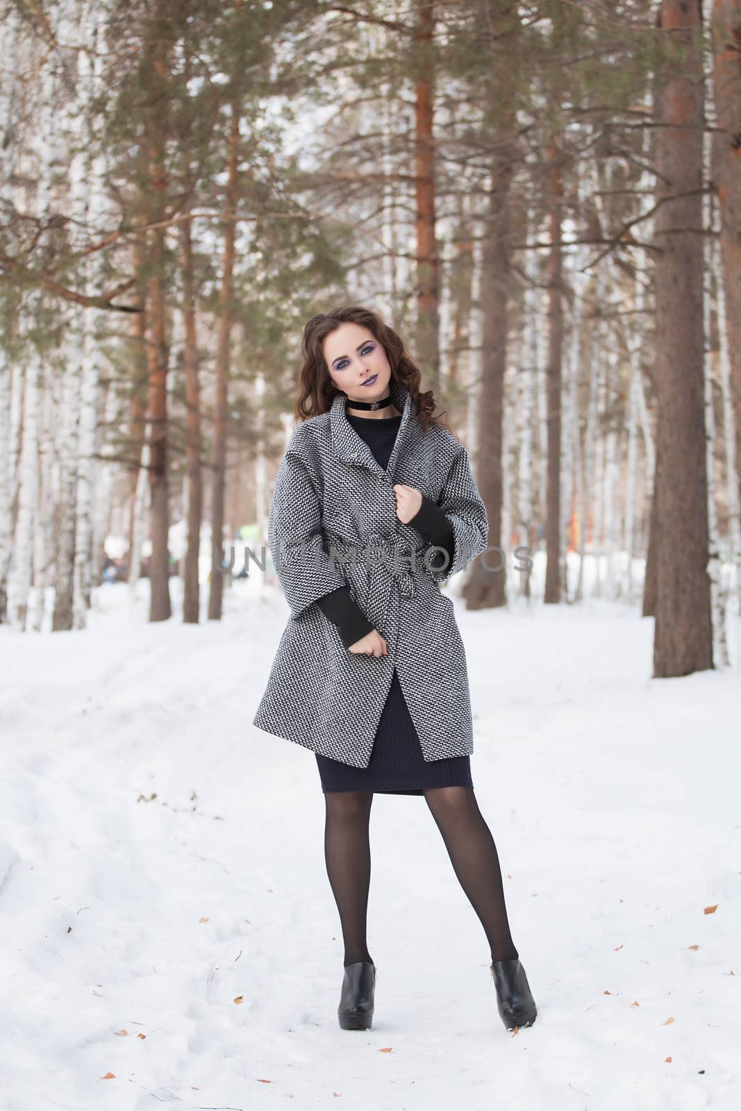 portrait of beautiful young woman smiling in winter time