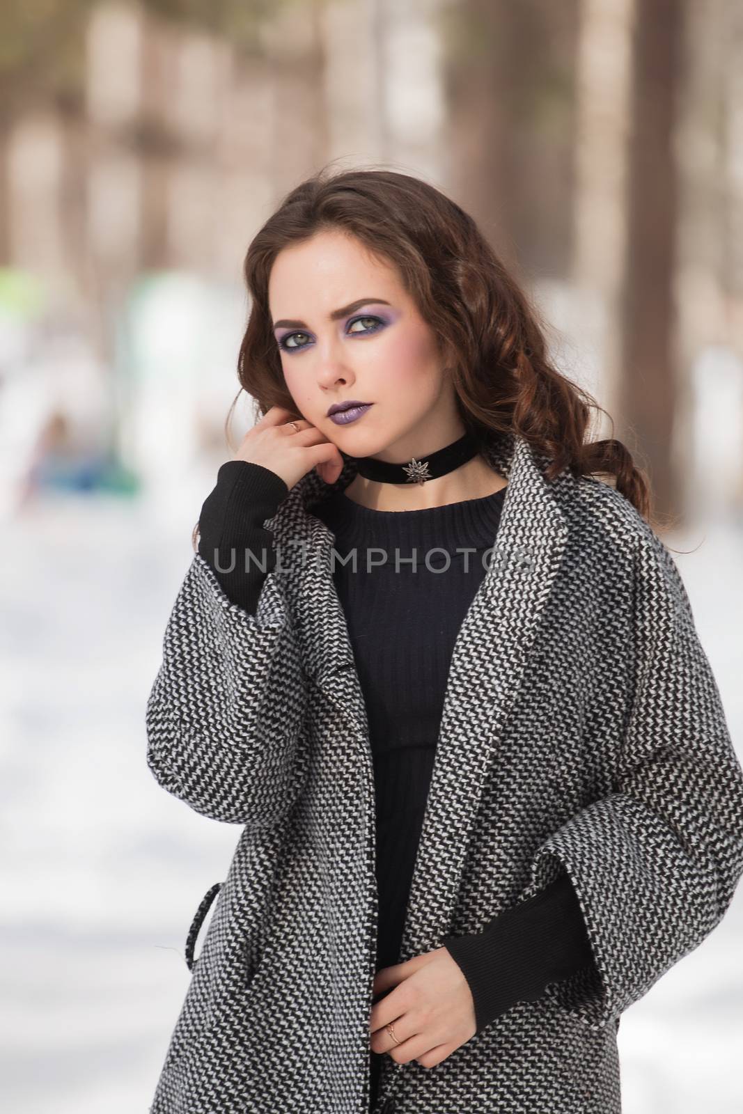 portrait of beautiful young woman smiling in winter time