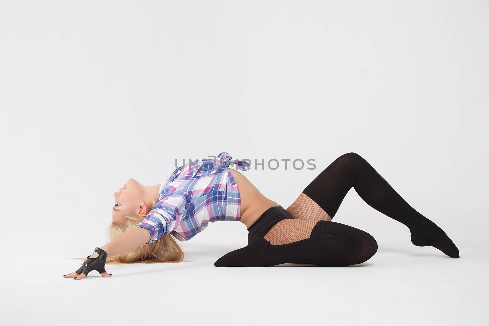 Girl gymnast. Young girl doing gymnastic exercises isolated by 3KStudio