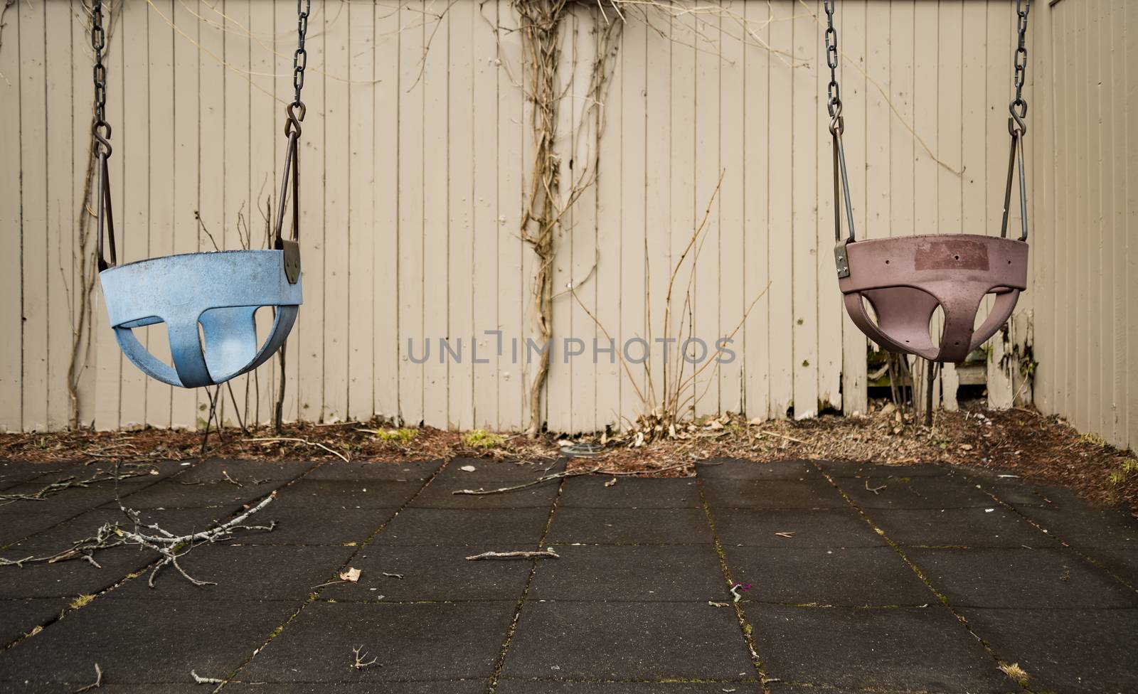 Children swing, playground in the park vintage tone  by edella