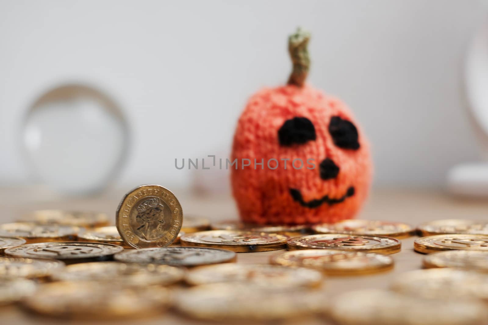 Small two colours one pound coin. British money halloween concept.