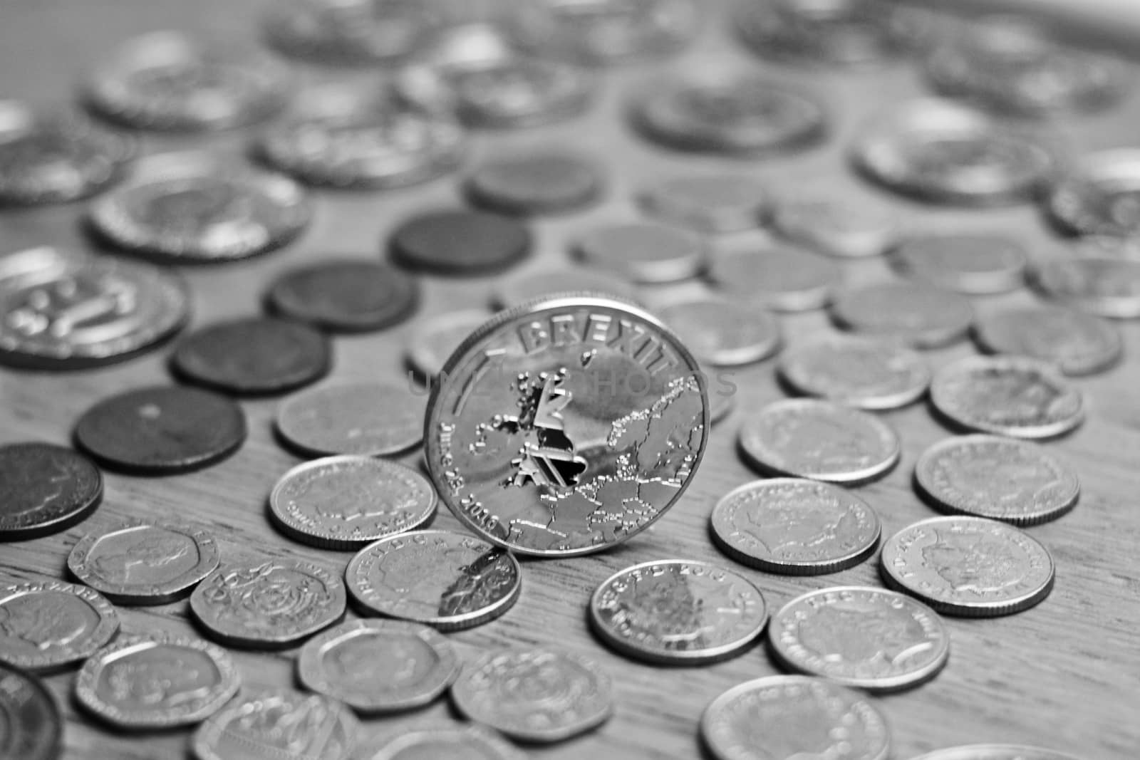 Physical metal silver brexit coin with British map on the front. Europe leaving. Article 50.