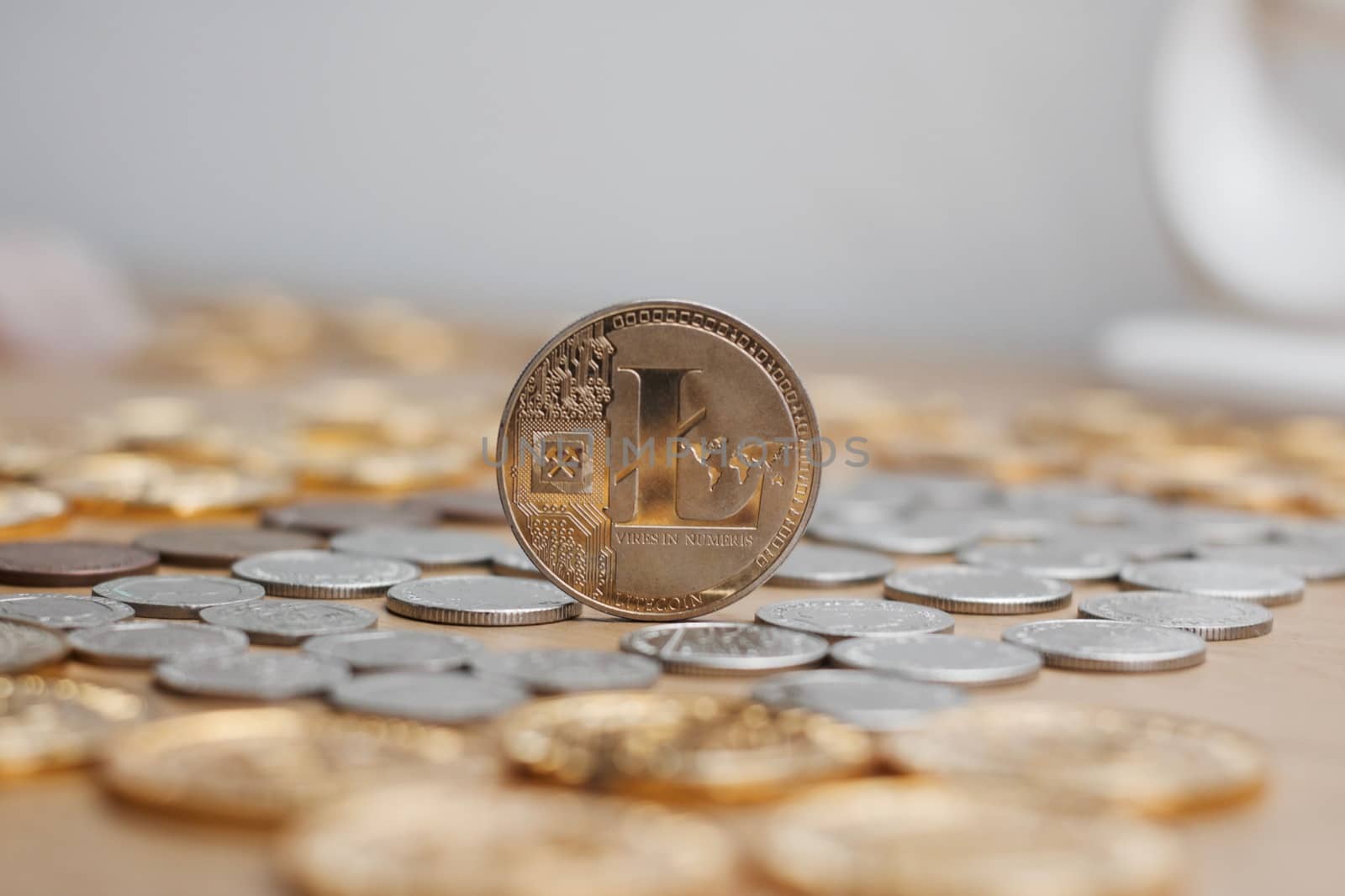Digital currency physical metal litecoin coin. Cryptocurrency mining concept.