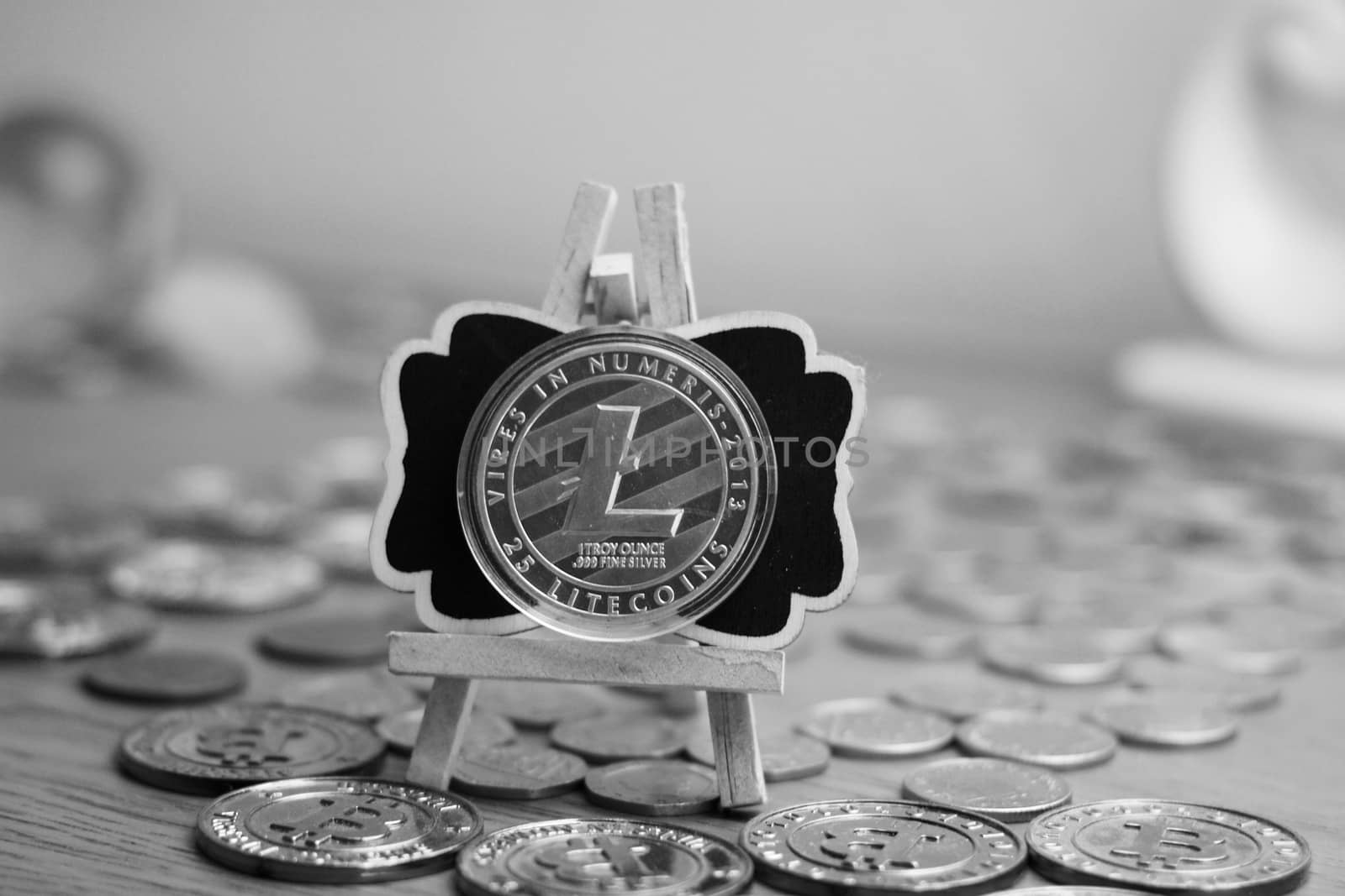 Digital currency physical metal litecoin coin. Cryptocurrency mining concept.