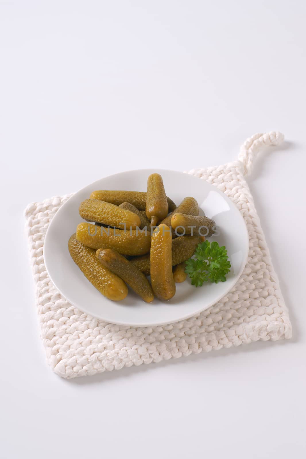 plate of pickled cucumbers by Digifoodstock