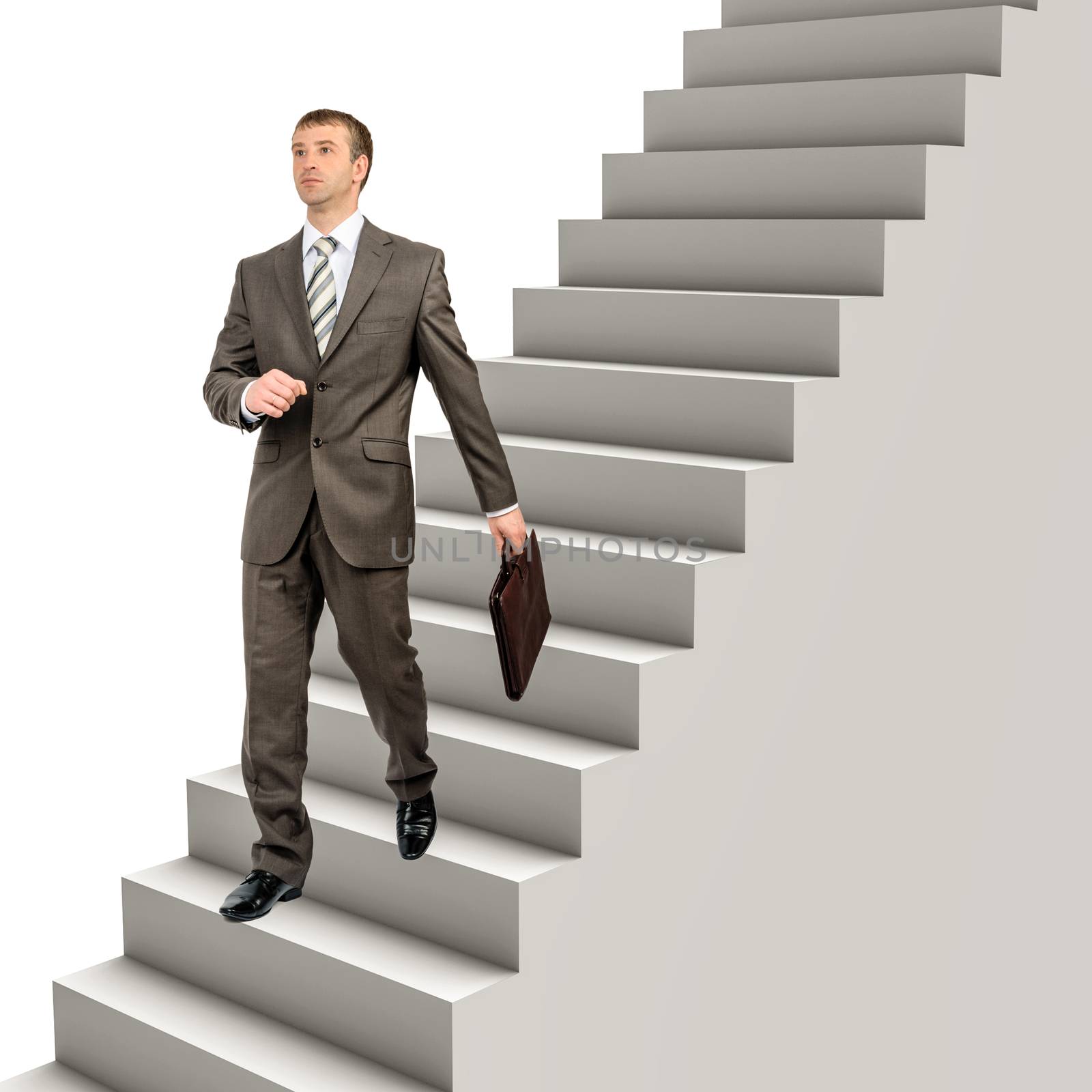 Businessman in formal wear walking down steps by cherezoff