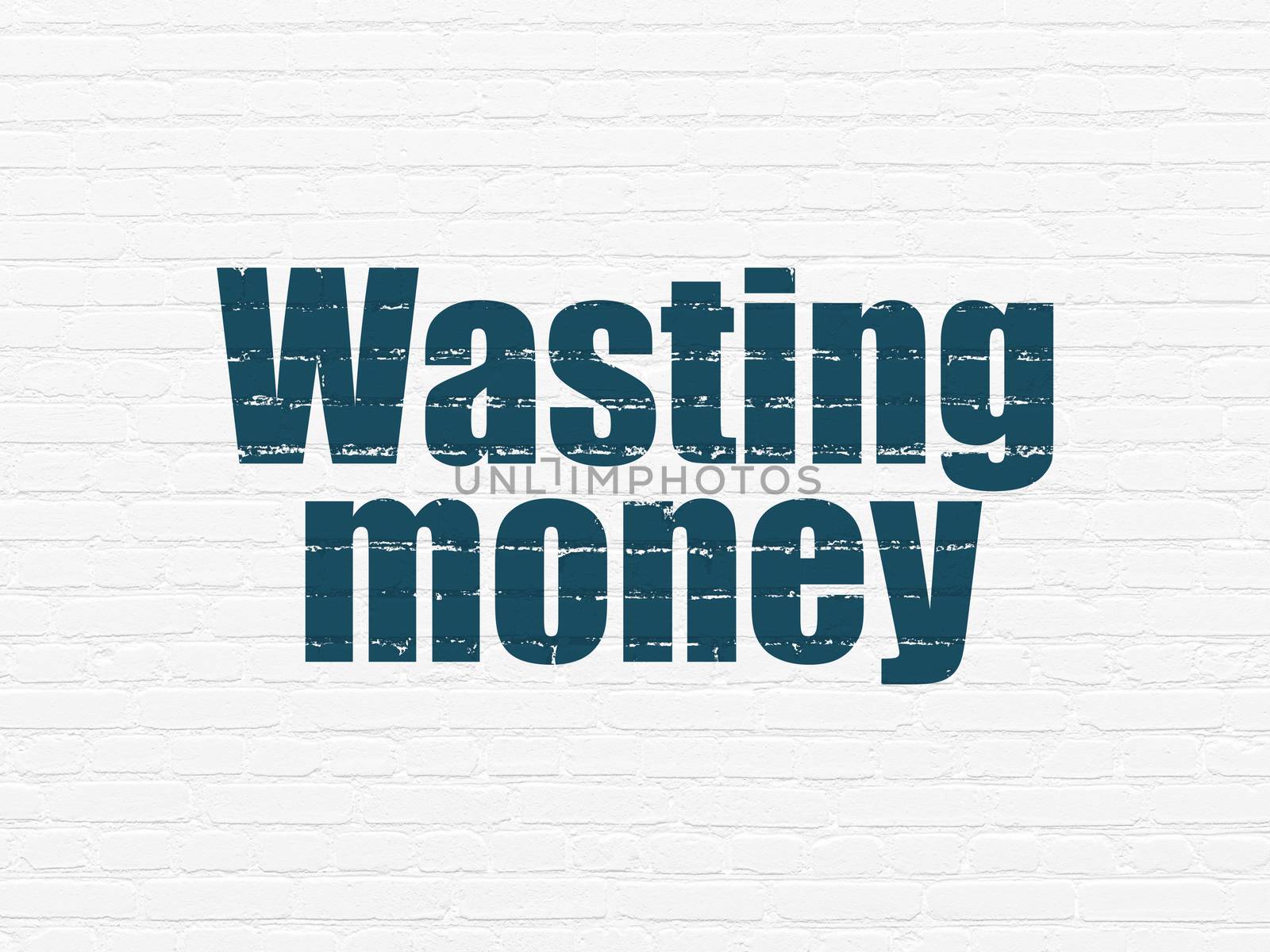 Money concept: Painted blue text Wasting Money on White Brick wall background