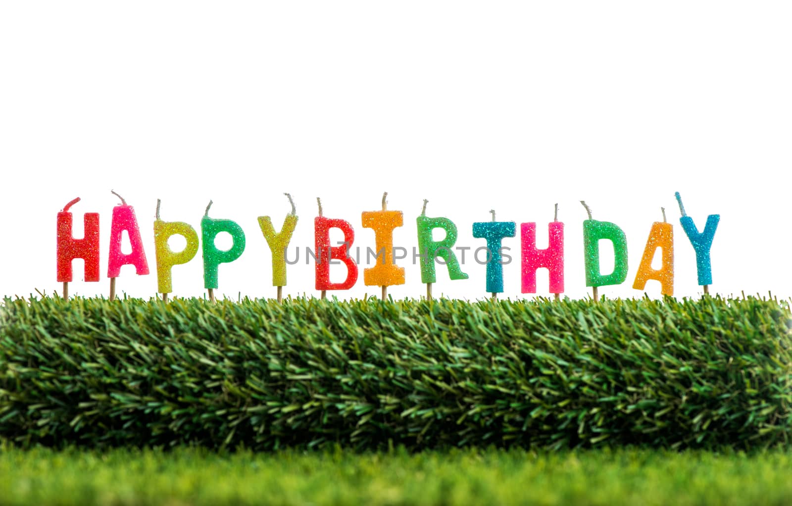 Birthday candles on grass