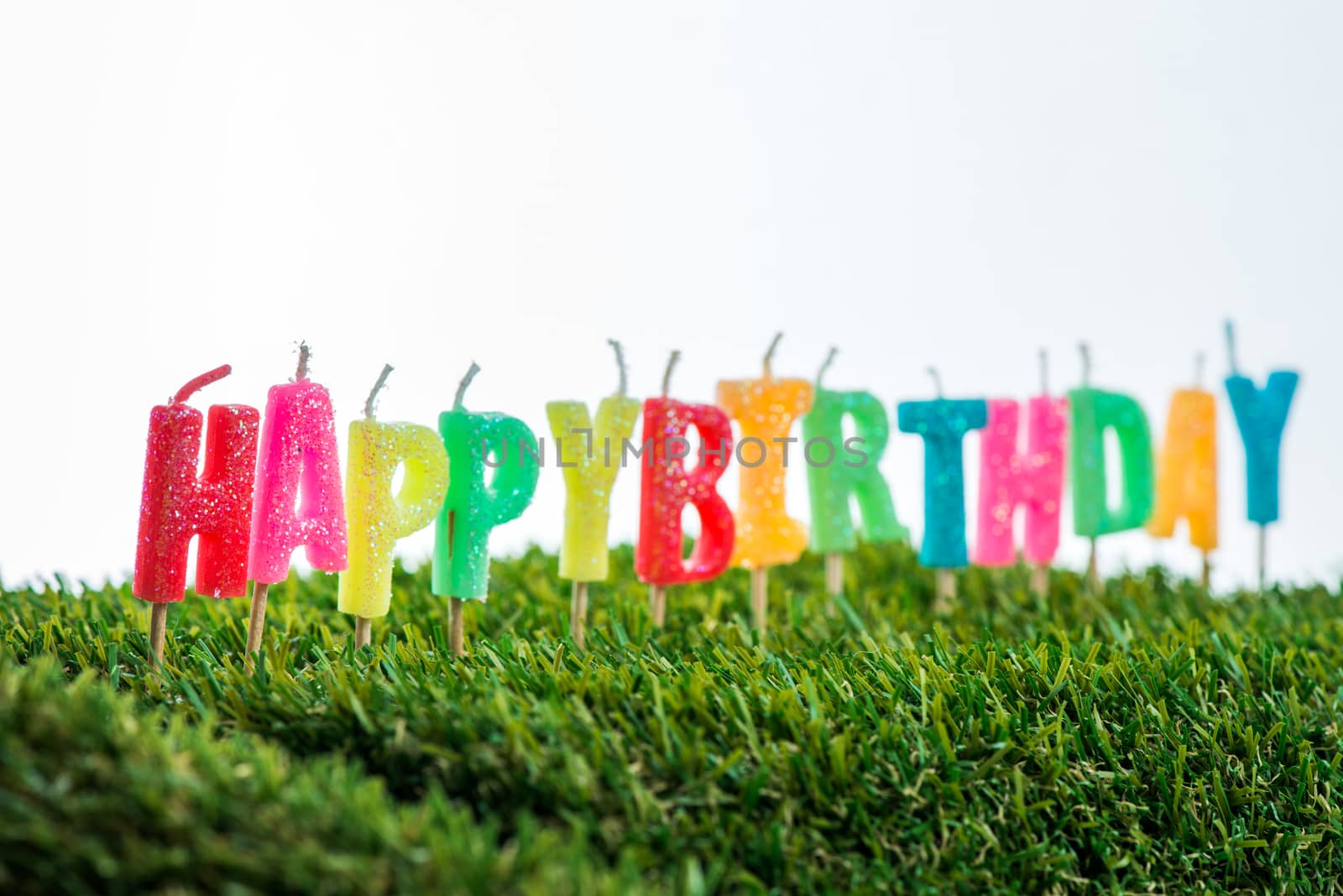 Birthday candles on grass