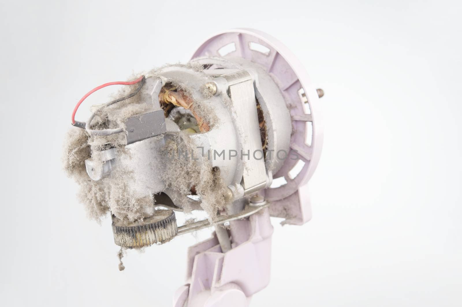 Close up motor of electric fan with dust white background by eaglesky