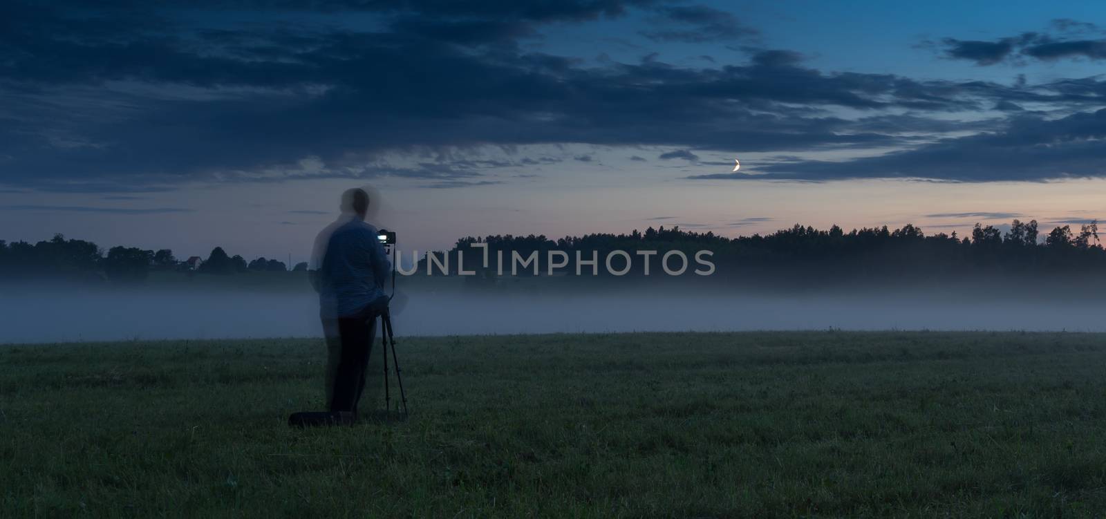 Photographer in a fog field by javax