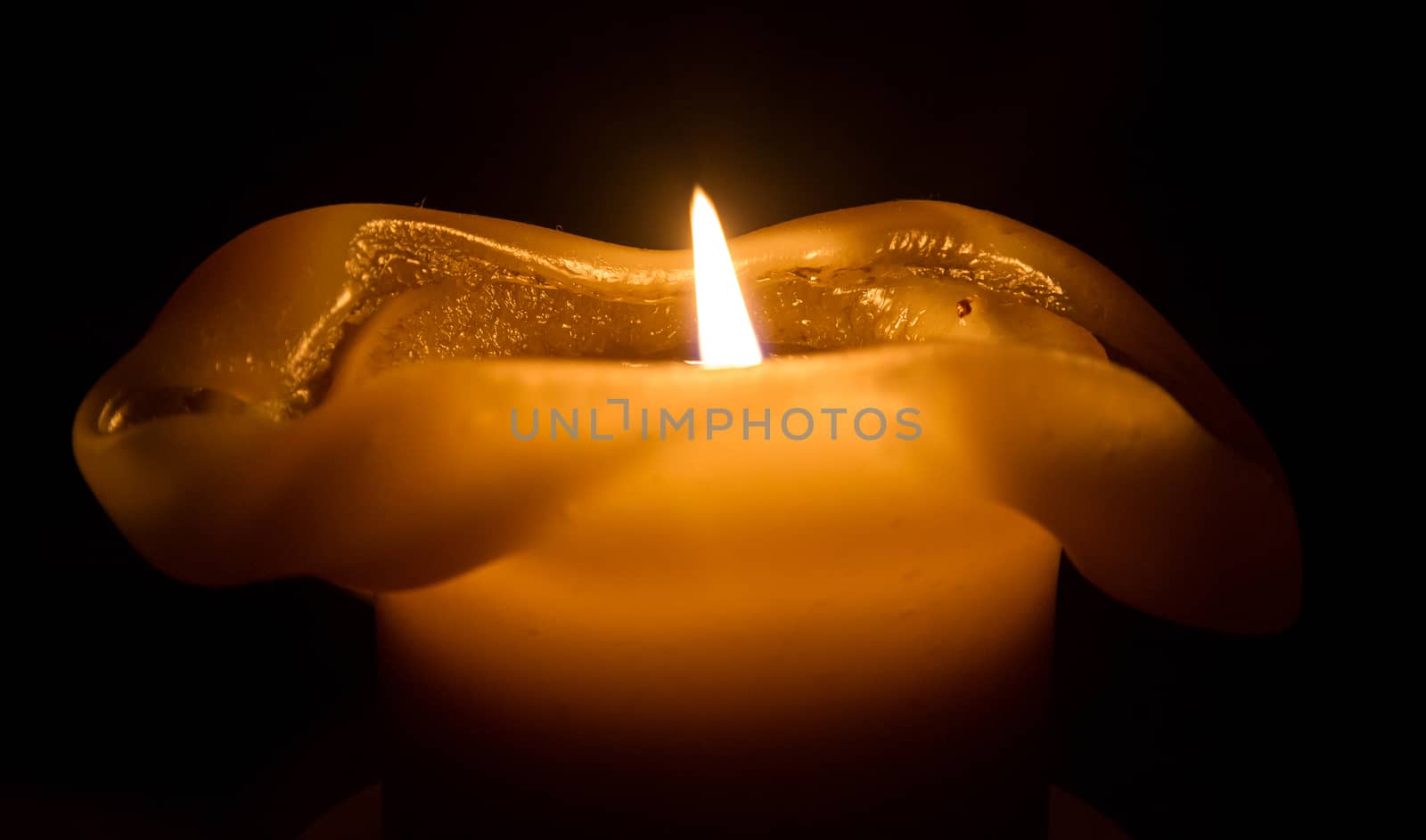 Large candle burning by michaklootwijk