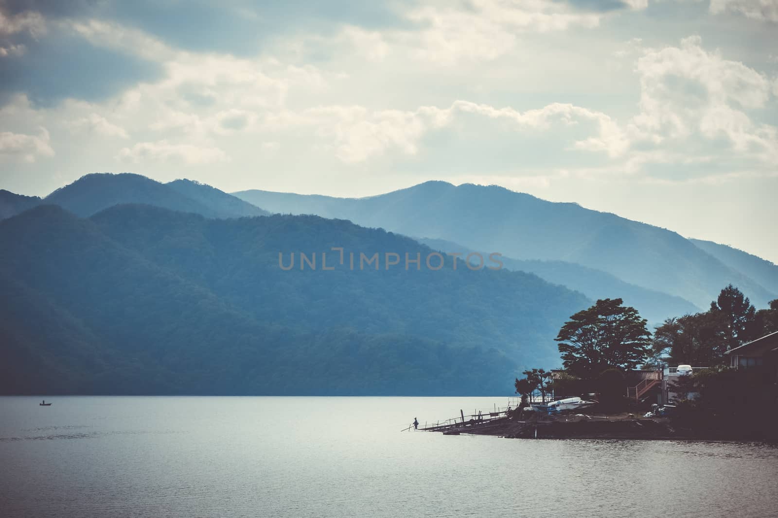 Fisherman on Chuzenji lake in Nikko National Park, Japan